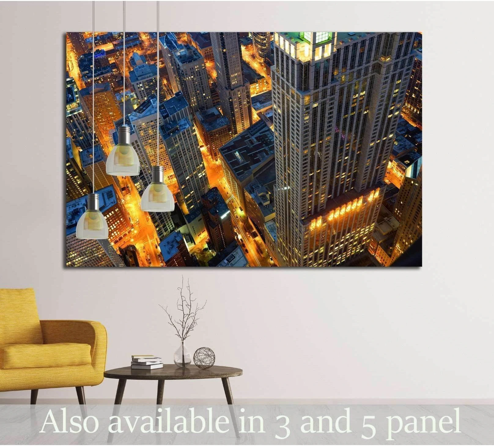 Chicago night skyline canvas print with glowing streets and skyscrapers above a sofa in a modern living room