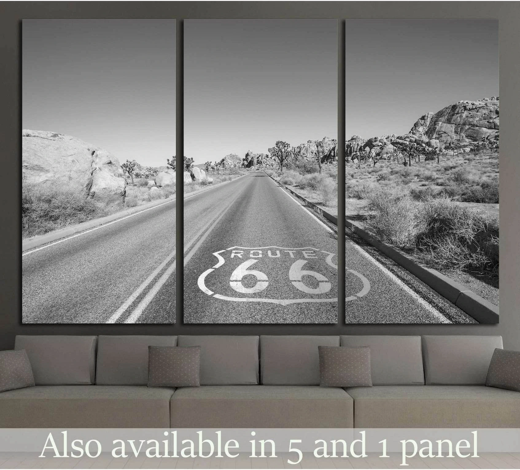 Black and white Route 66 canvas print with desert highway and Joshua trees above a sofa