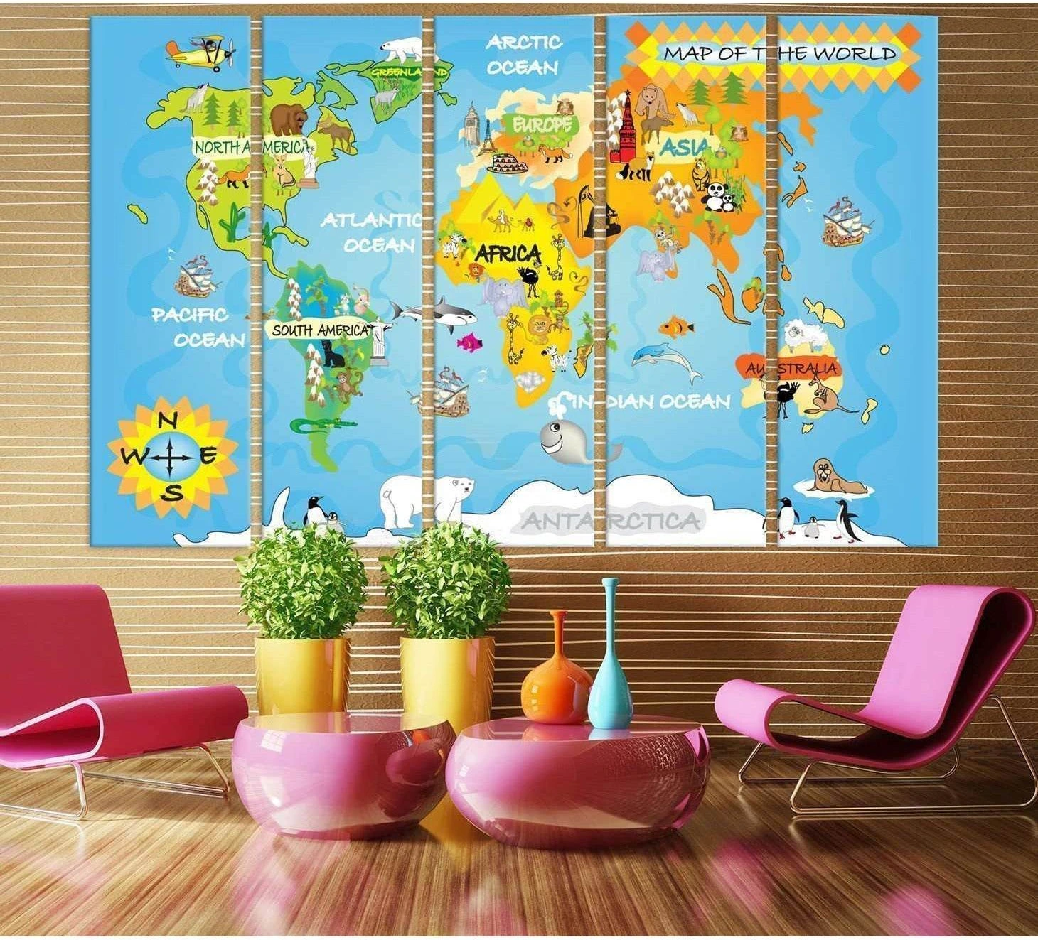 Kids world map triptych canvas print with labeled continents, oceans, and cartoon animals in a nursery room
