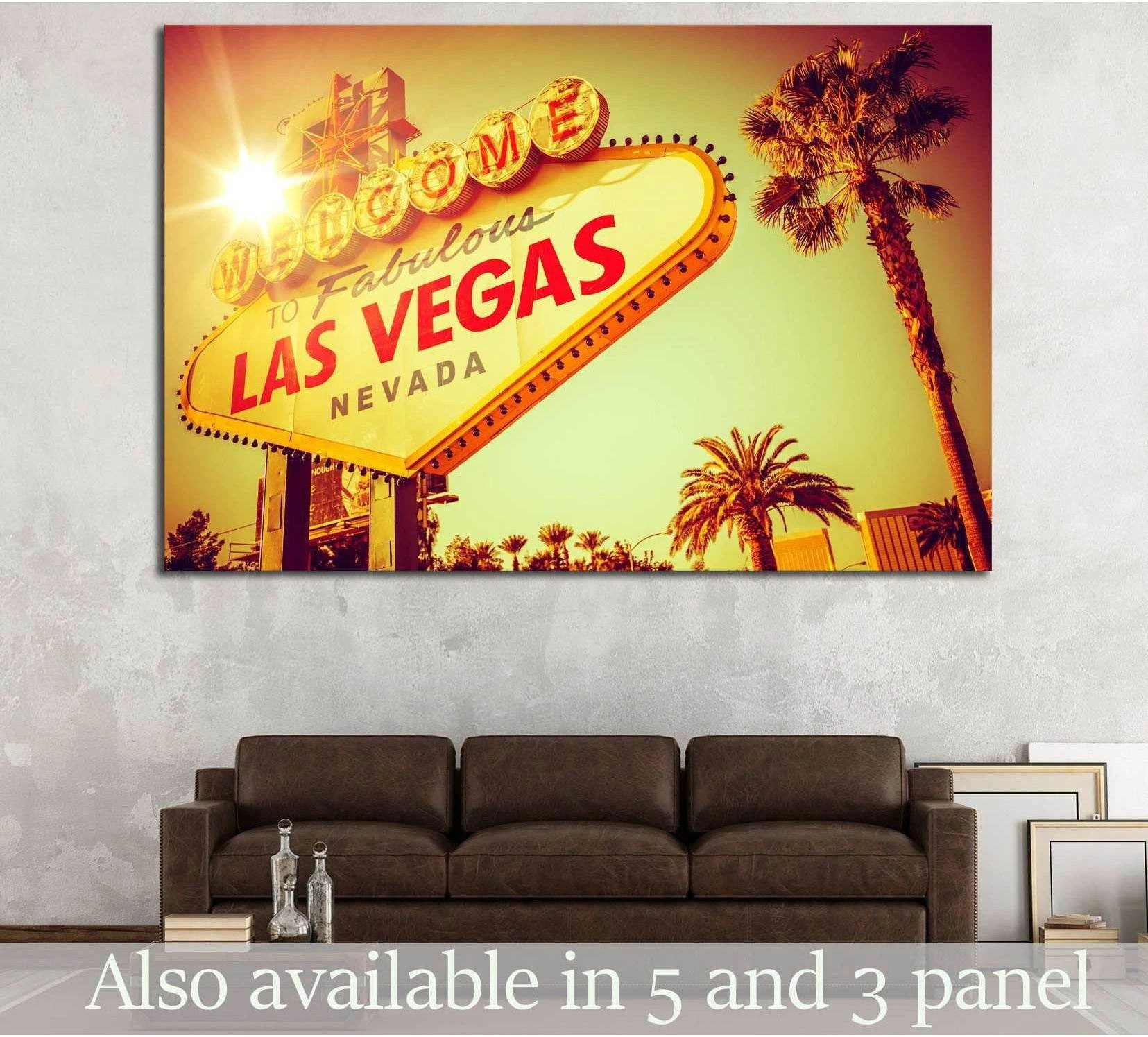 Retro Las Vegas sign canvas print with palm trees in sunset tones above a sofa