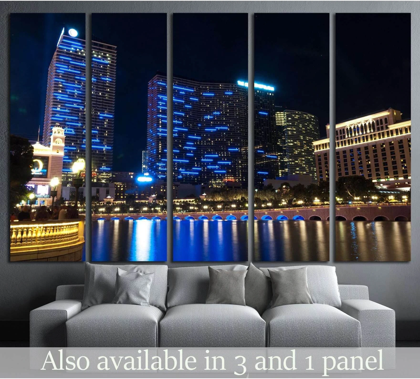 Las Vegas Strip night skyline canvas print above sofa with blue hotel lights and water reflections