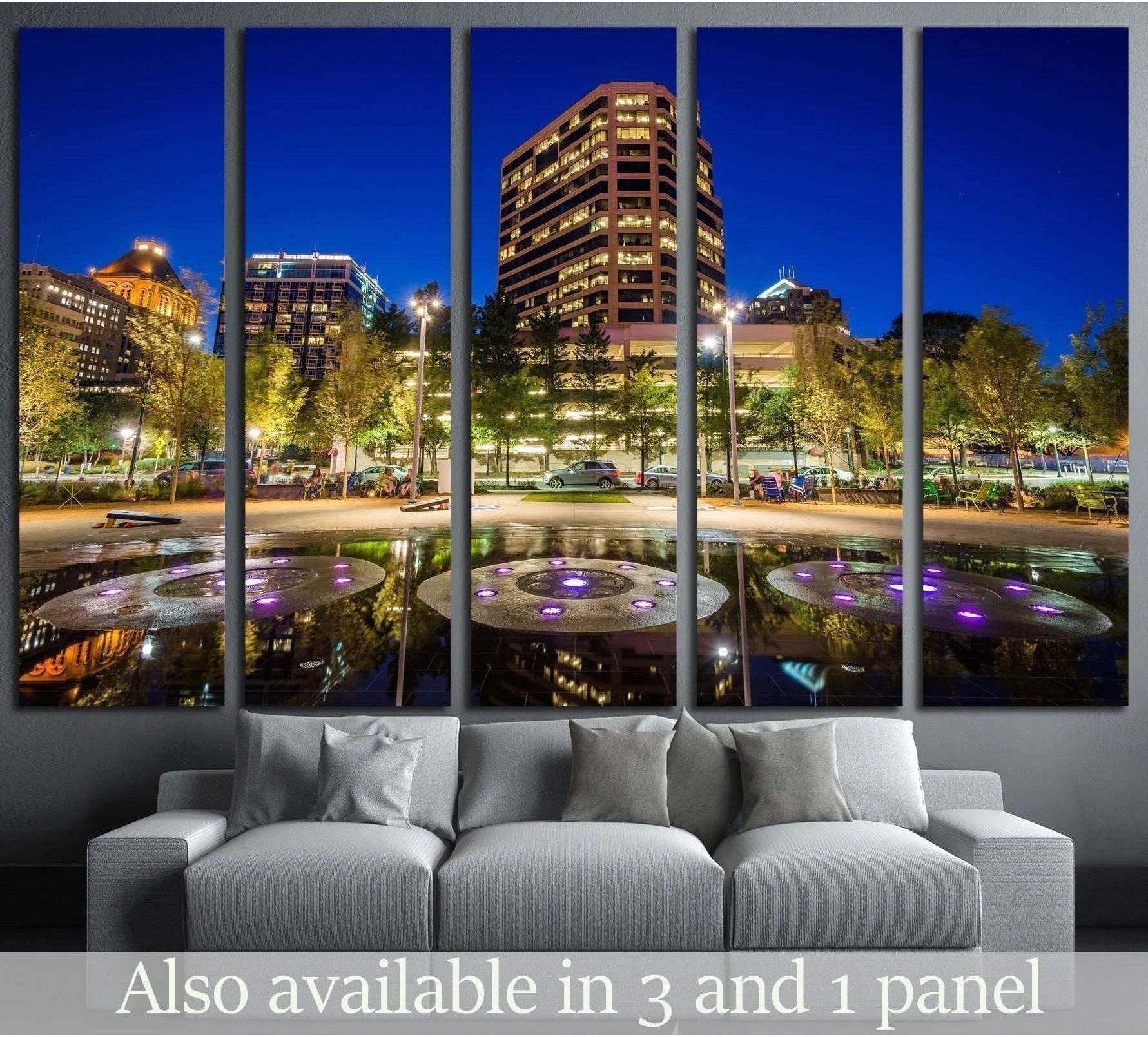 LeBauer Park at night canvas print above a sofa with lit fountains and downtown Greensboro skyline