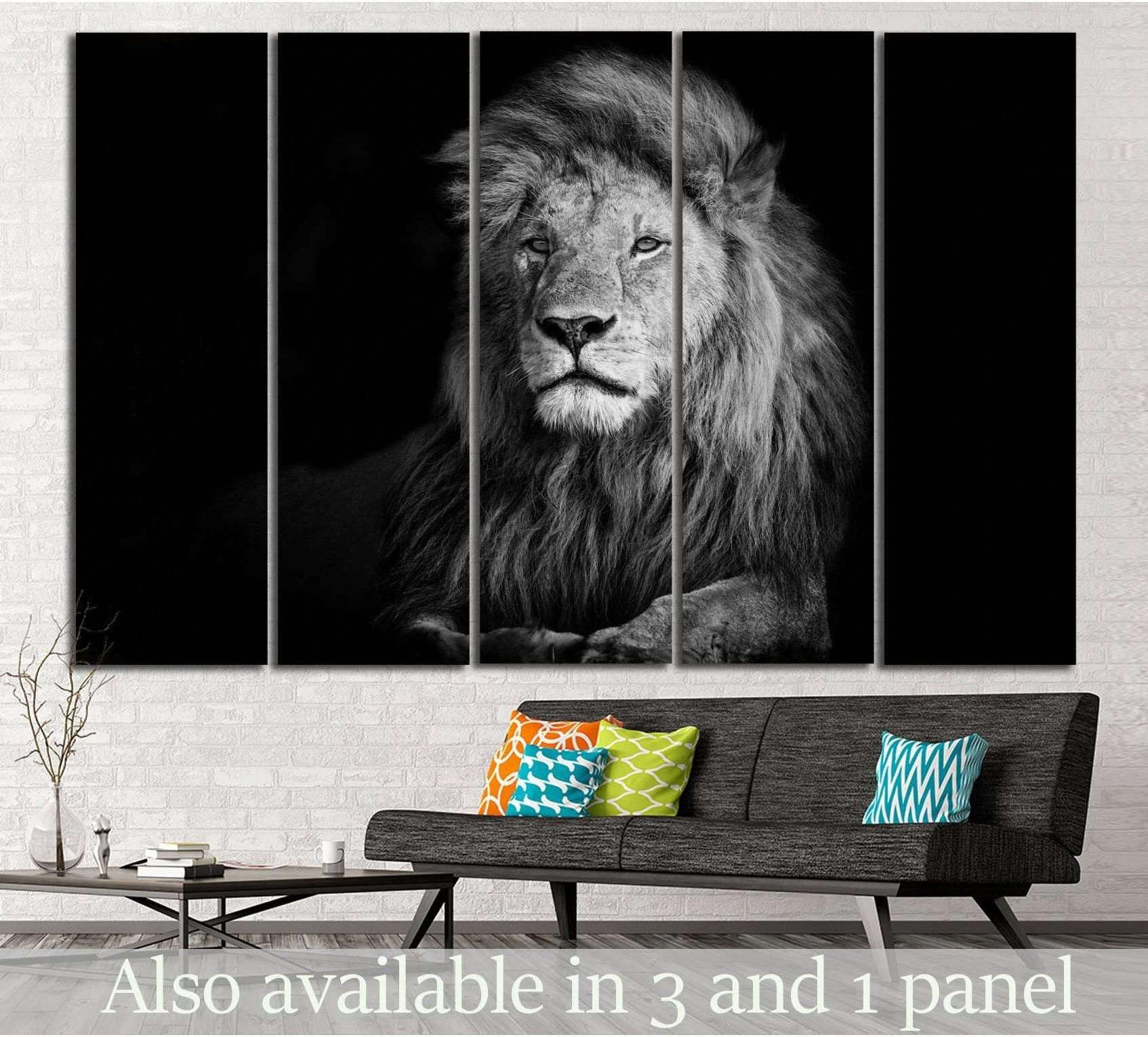Black and white lion canvas print in a five-panel layout above a sofa in a modern living room