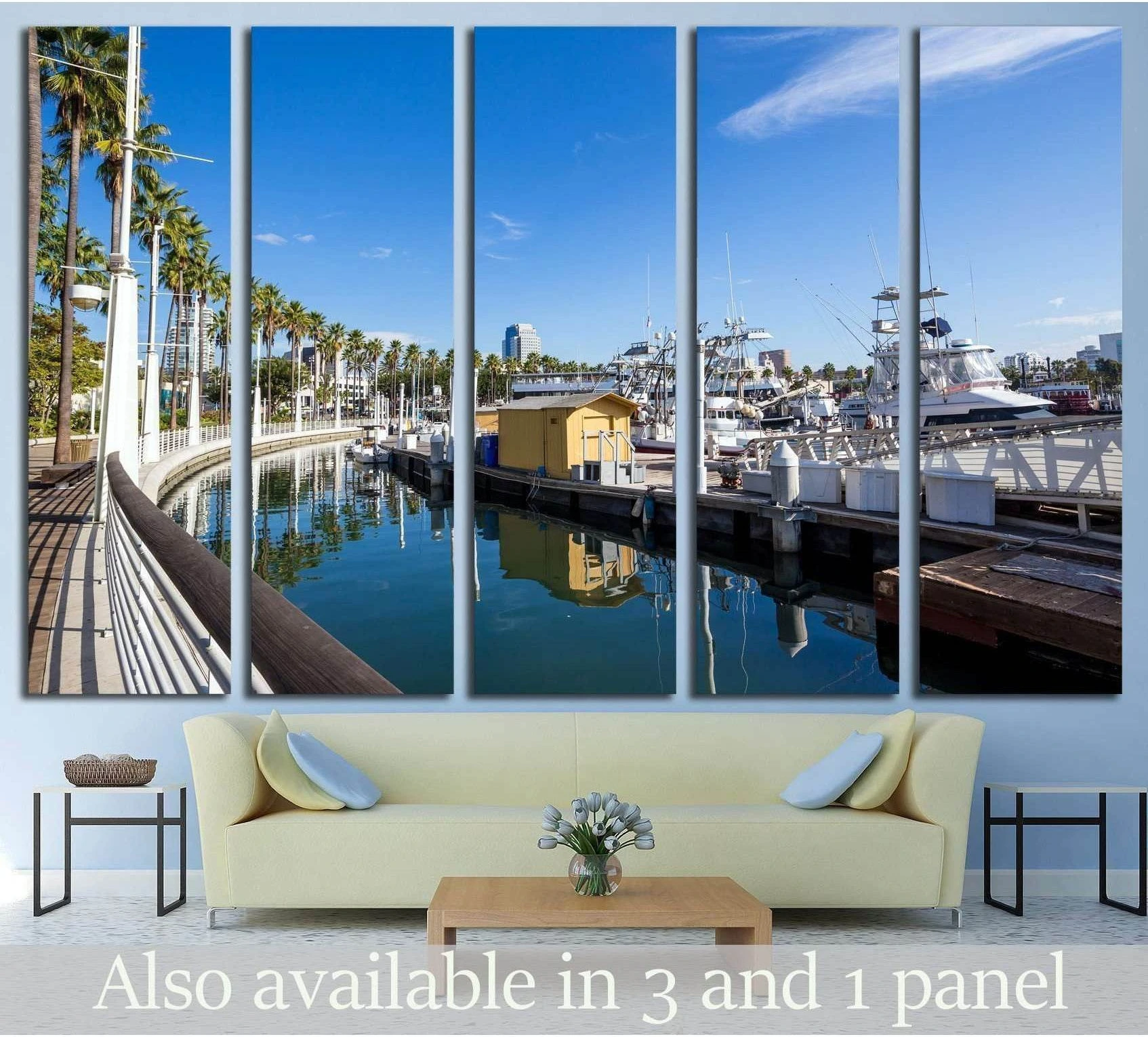 Long Beach marina canvas print with palm trees, yachts, and city skyline above a sofa in a coastal living room