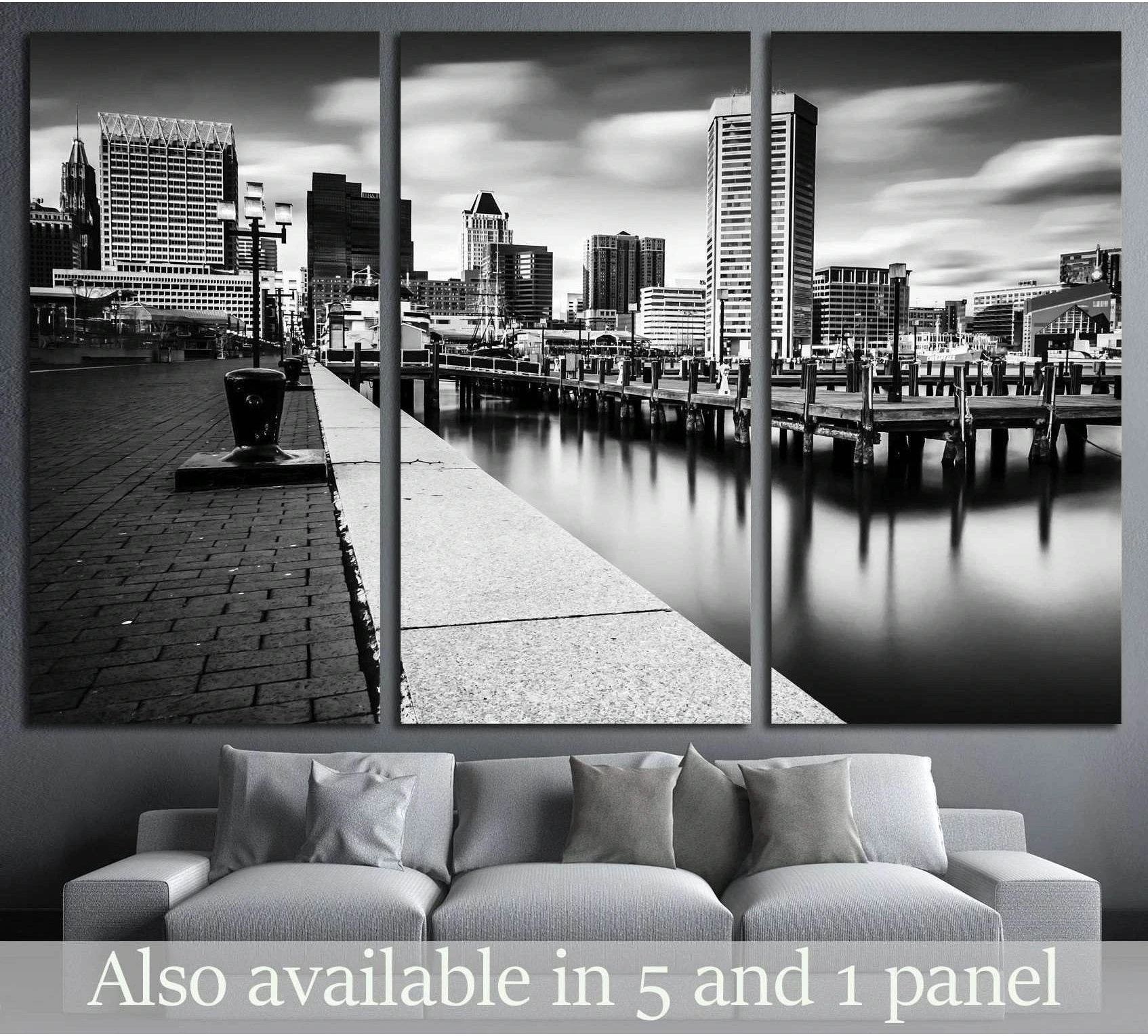 Black and white Baltimore skyline triptych canvas print above a sofa in a modern living room