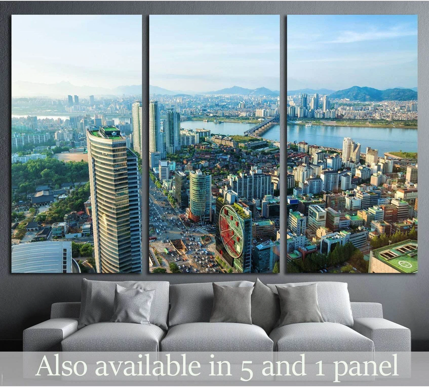 Triptych Seoul skyline canvas print overlooking downtown and the Han River above a gray sofa