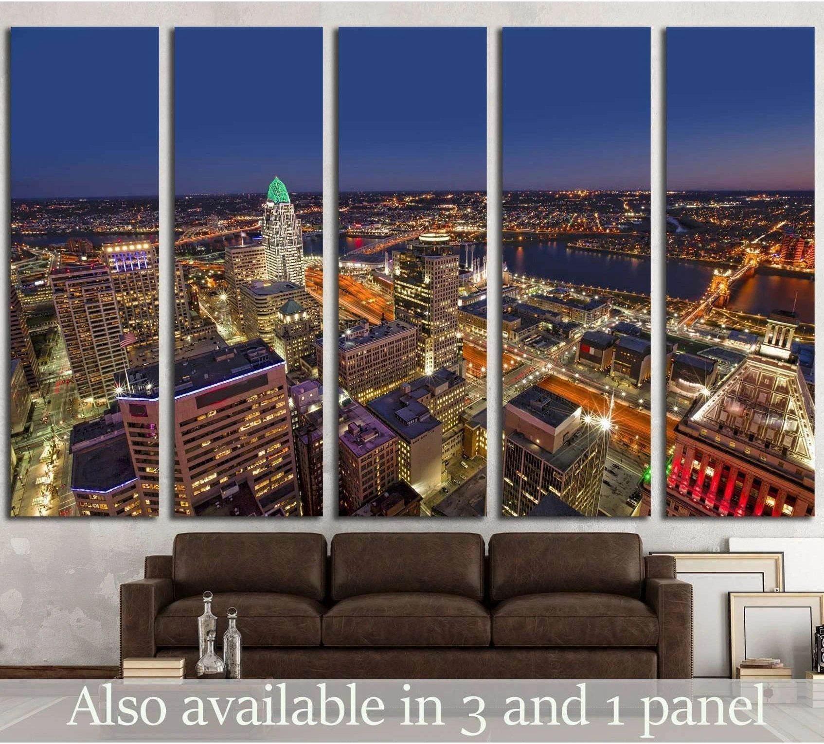 Cincinnati skyline canvas print with downtown lights and riverfront at dusk displayed above a brown sofa