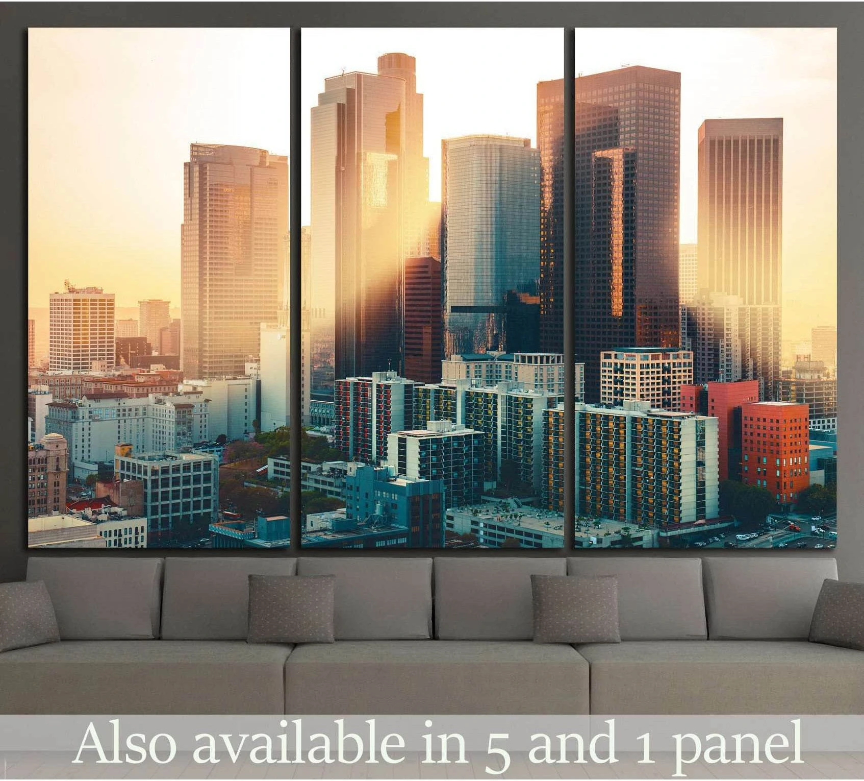 Los Angeles skyline triptych canvas print with downtown towers in warm sunset light above a sofa