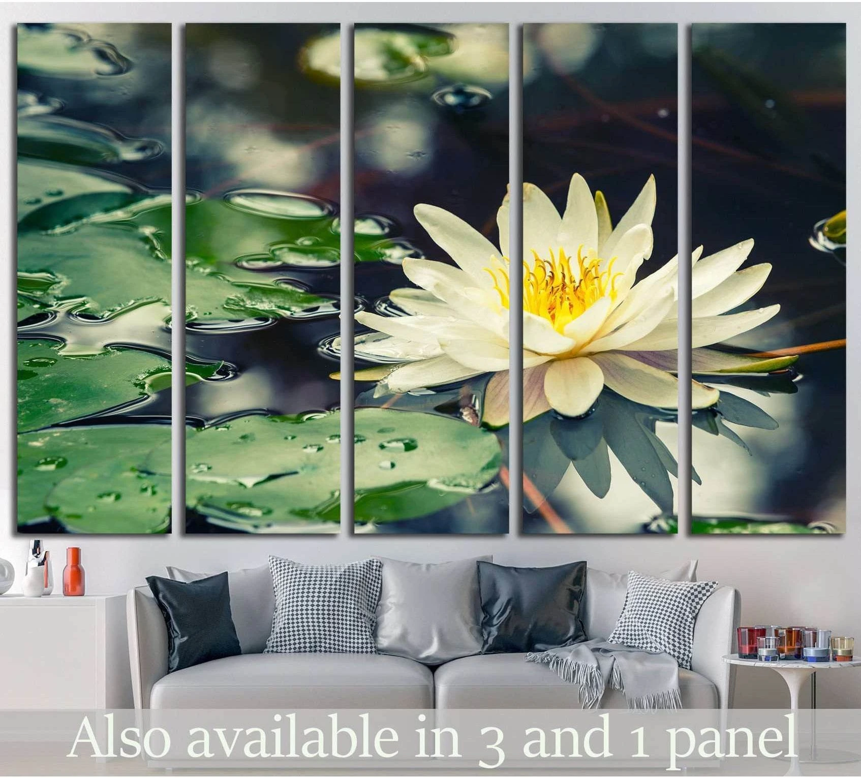 White water lily canvas print with green lily pads hung above a sofa in a calm modern living room