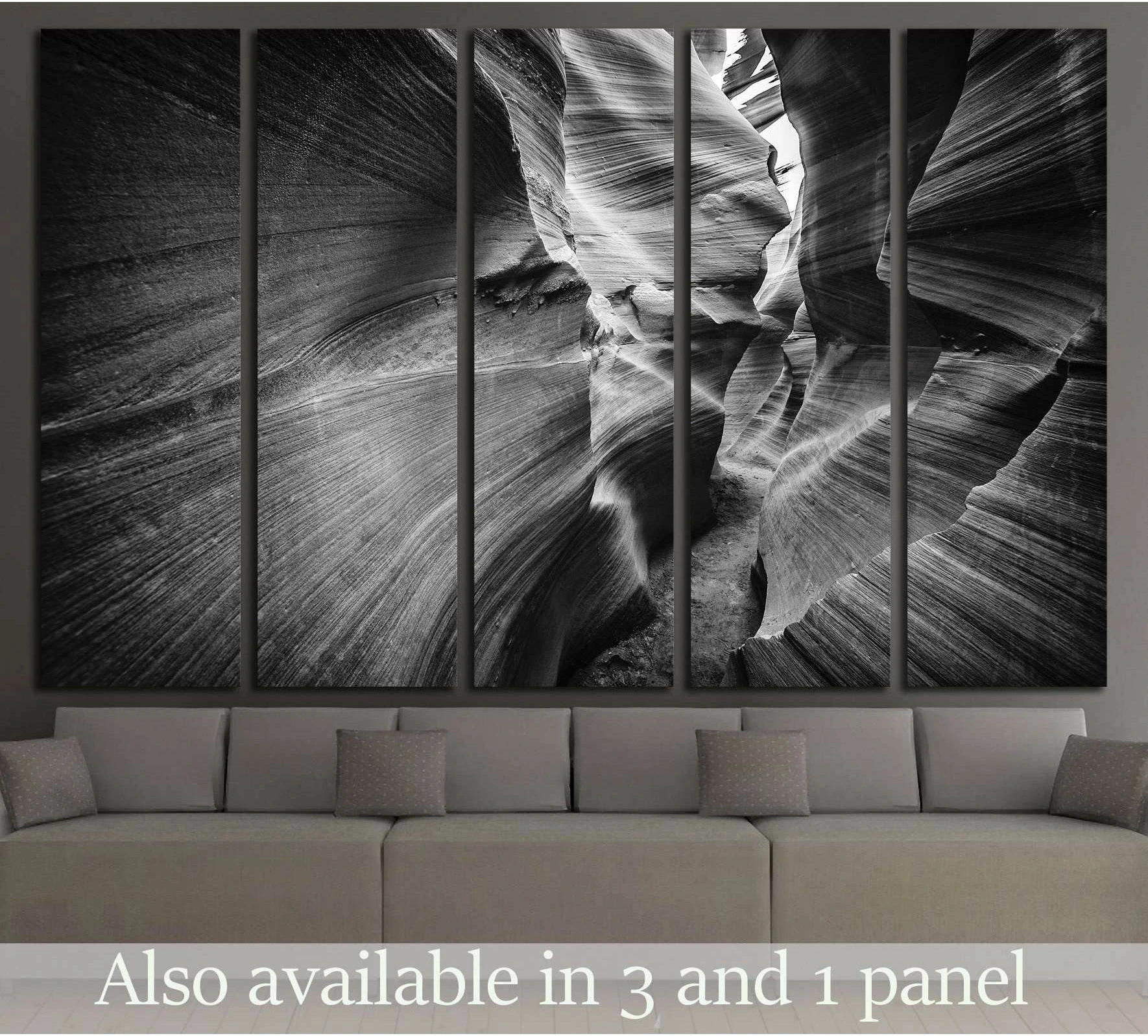Black and white Antelope Canyon canvas print in five panels above a sofa in a modern living room