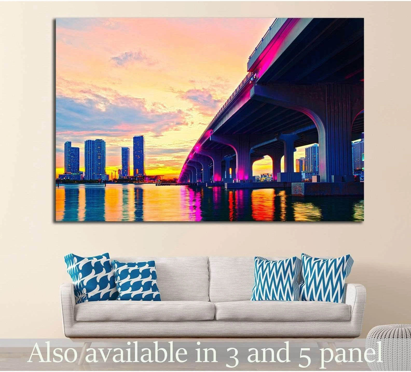 Miami MacArthur Bridge canvas print with sunset skyline reflections, hung above a sofa in a modern living room