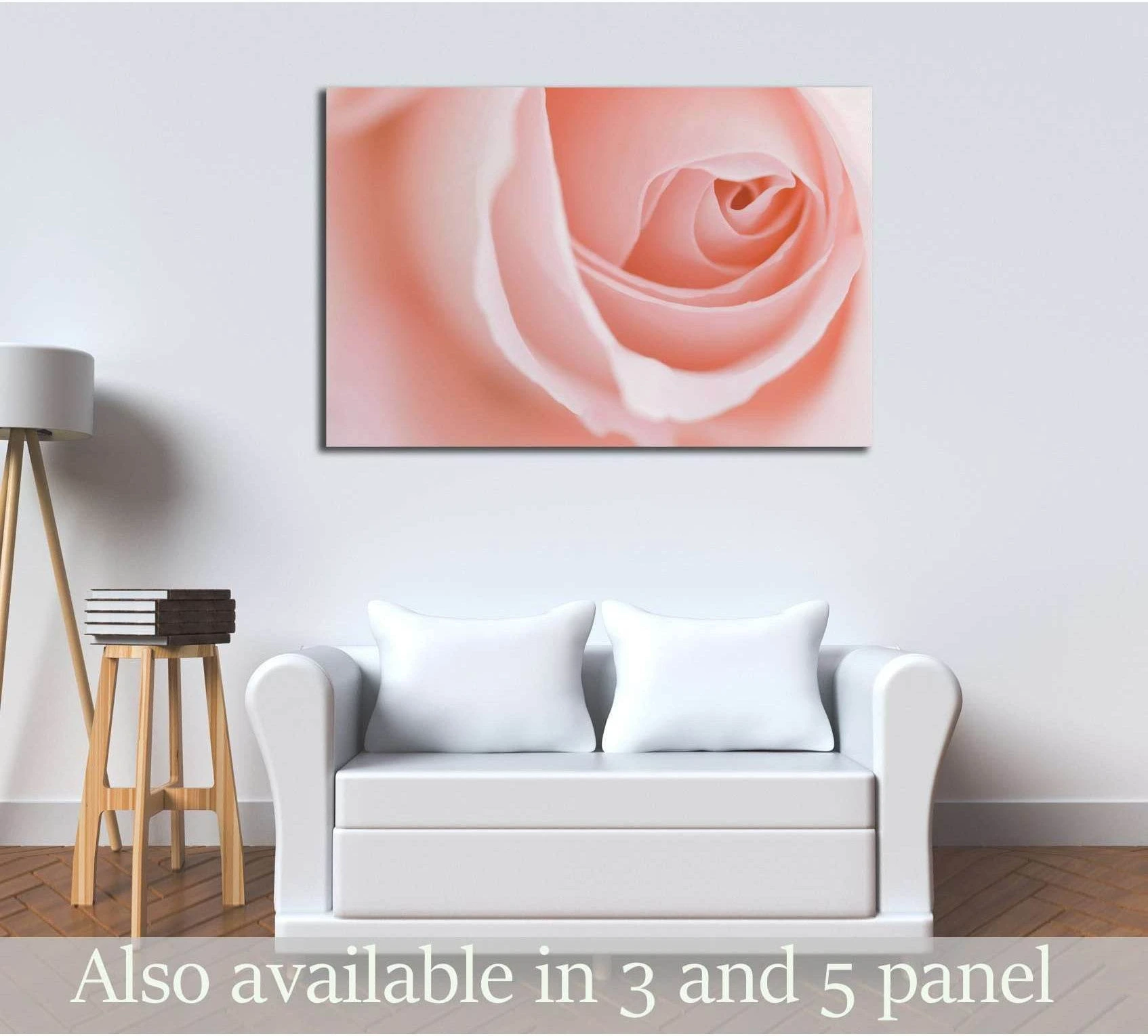 Soft pink rose macro canvas print hung above white sofa in a neutral living room