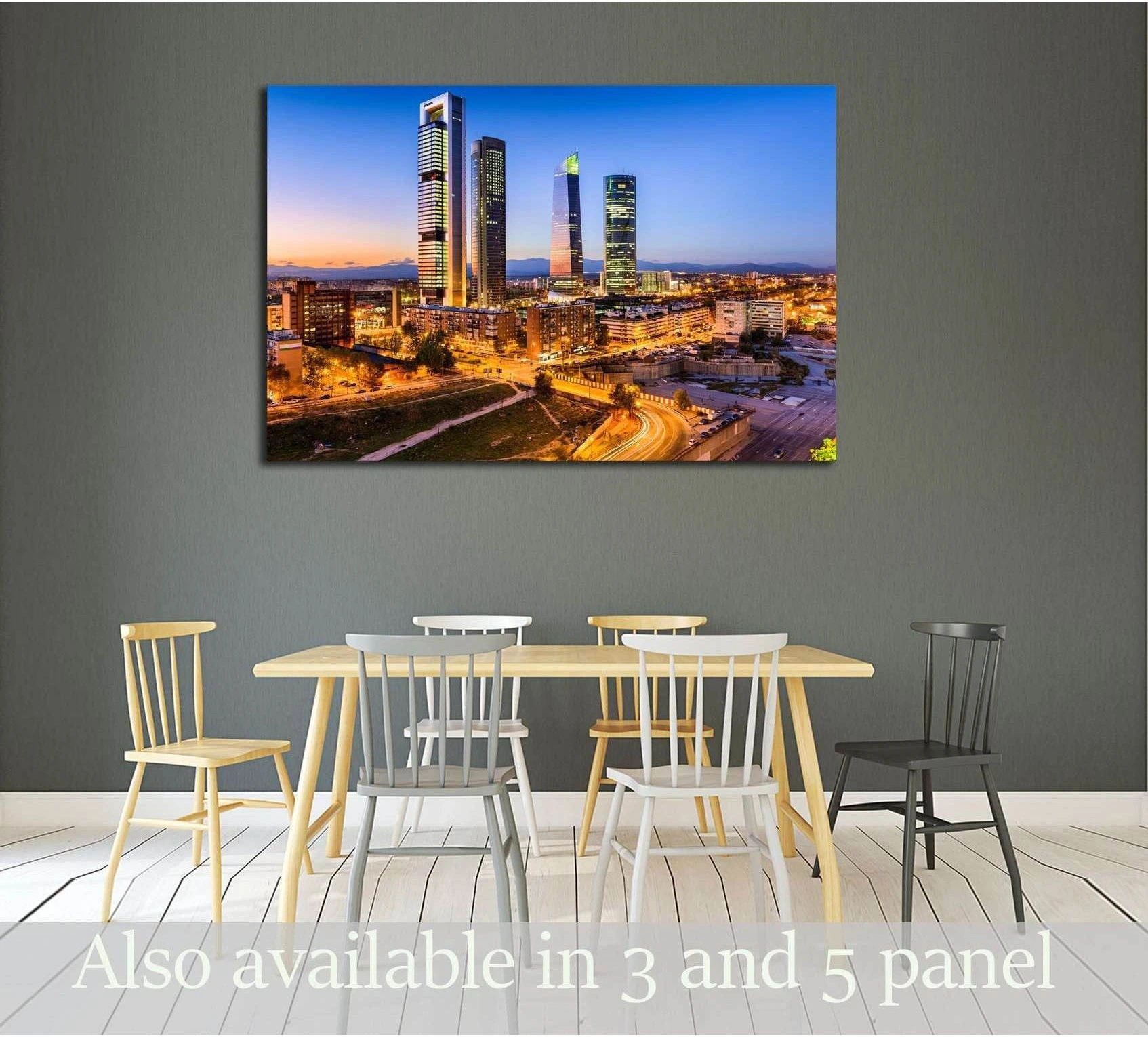 Madrid financial district skyline canvas print at twilight above a dining table in a modern room