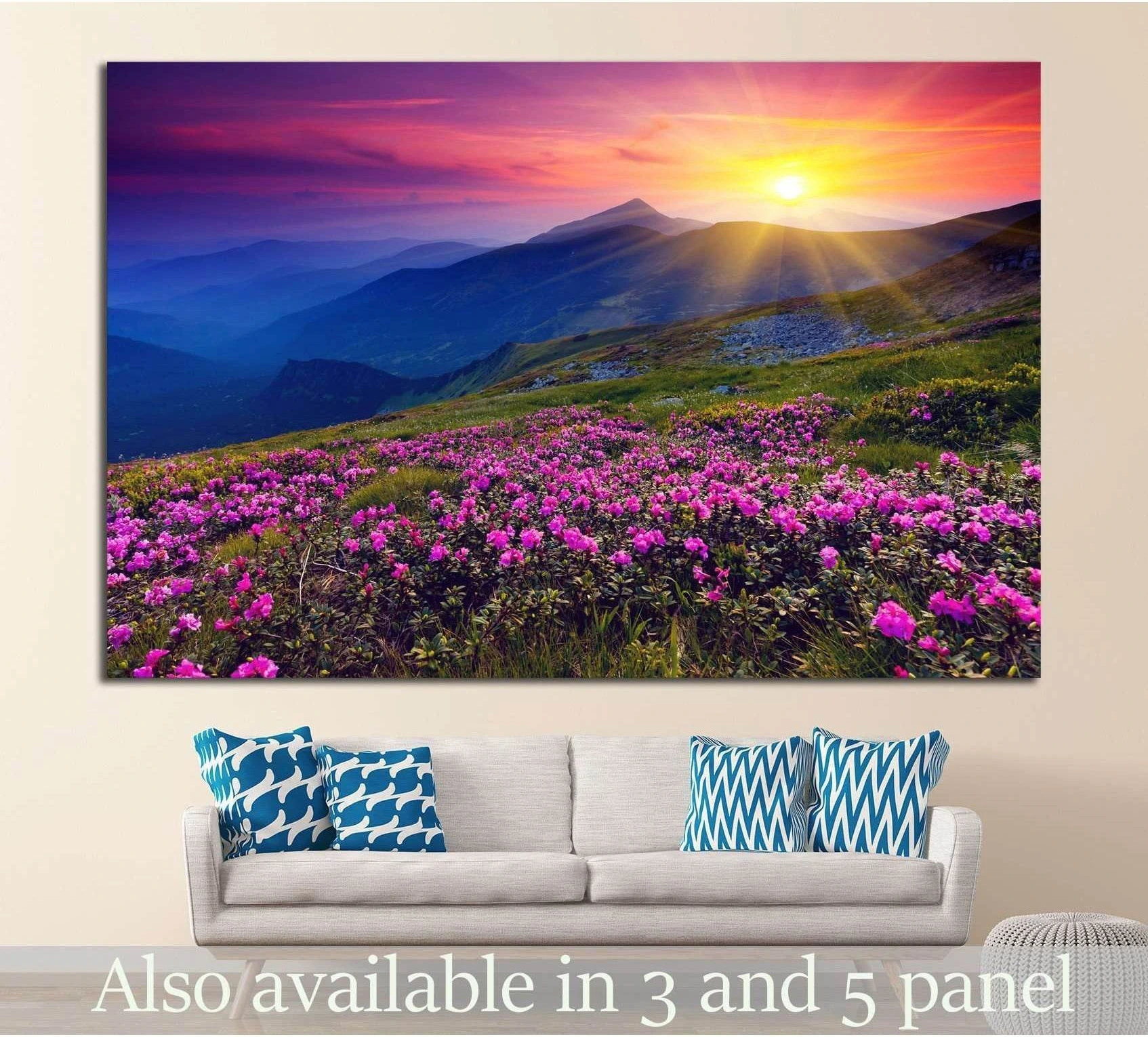 Pink rhododendron flowers canvas print with mountain sunrise above a sofa in a modern living room