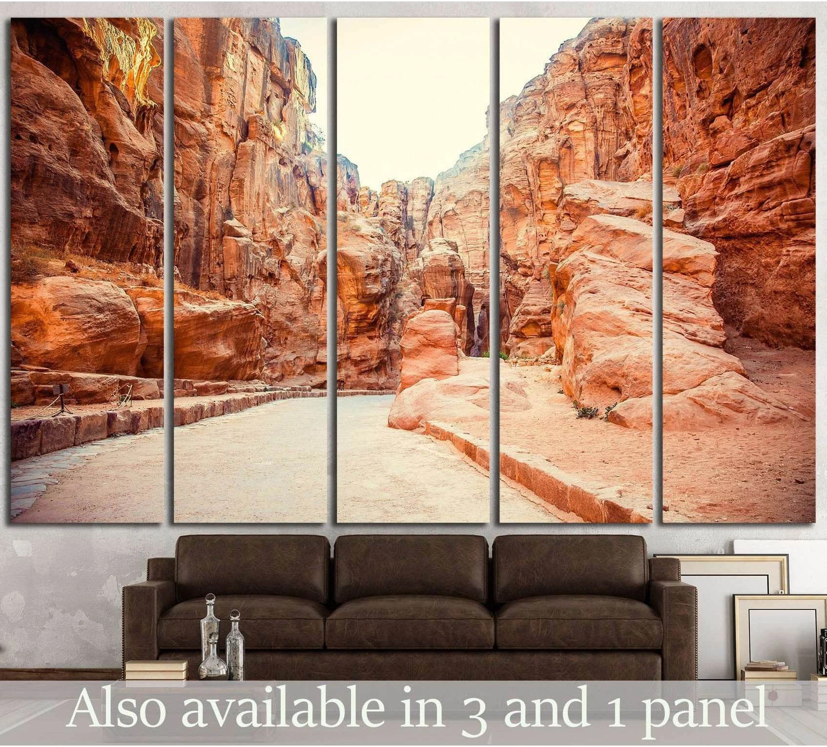 Five-panel ancient city canvas print showing a sunlit sandstone canyon passage above a brown sofa