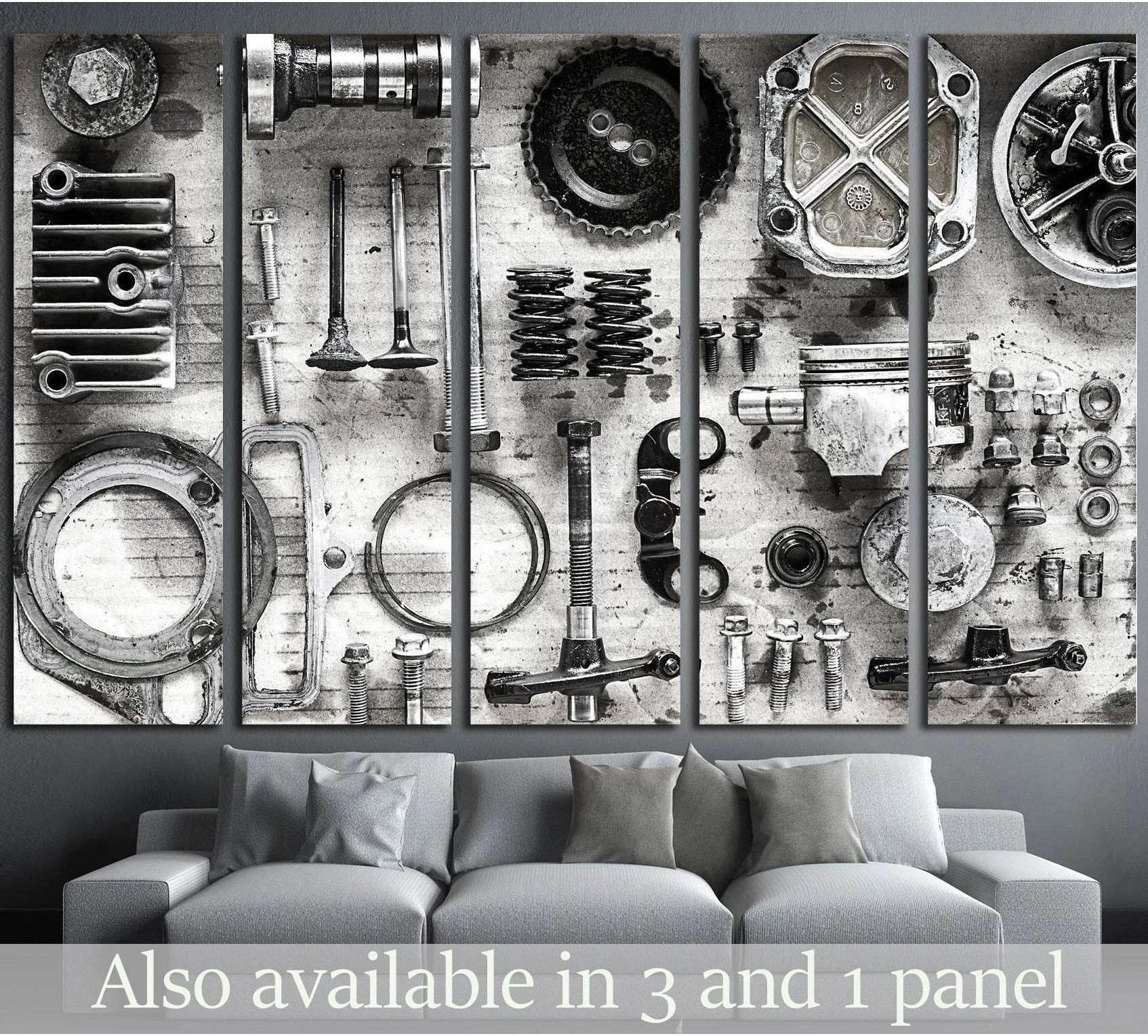 Black and white engine parts canvas print with vintage mechanical components above a gray sofa