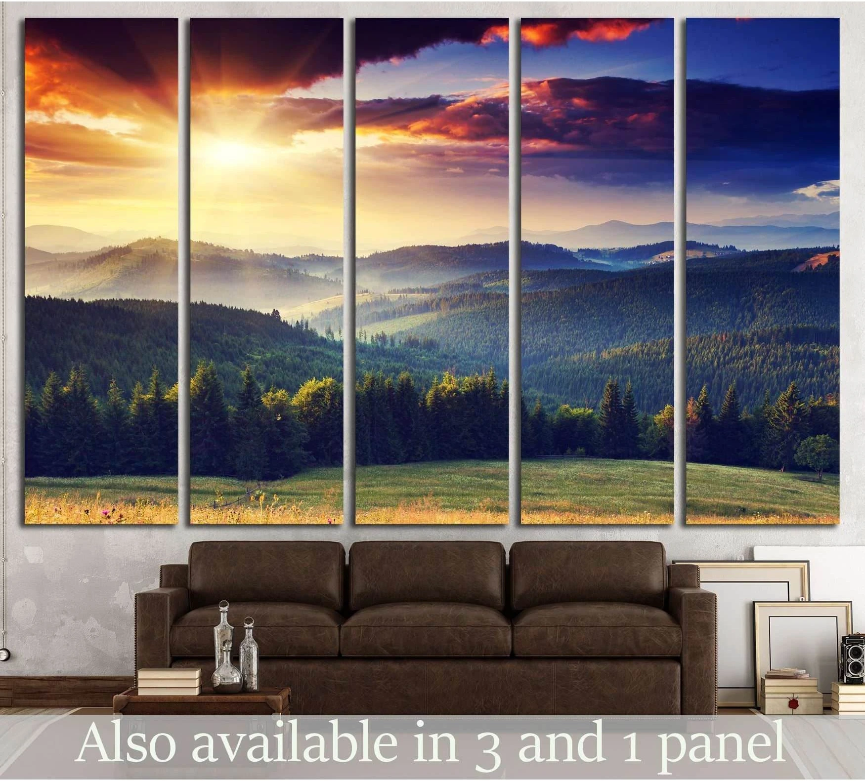 Mountain sunset canvas print with sun rays over forested hills and dramatic clouds above a sofa