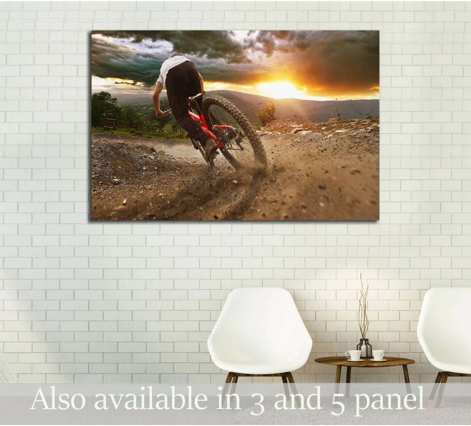 Mountain bike canvas print with rider on dirt trail at stormy sunset, displayed above chairs