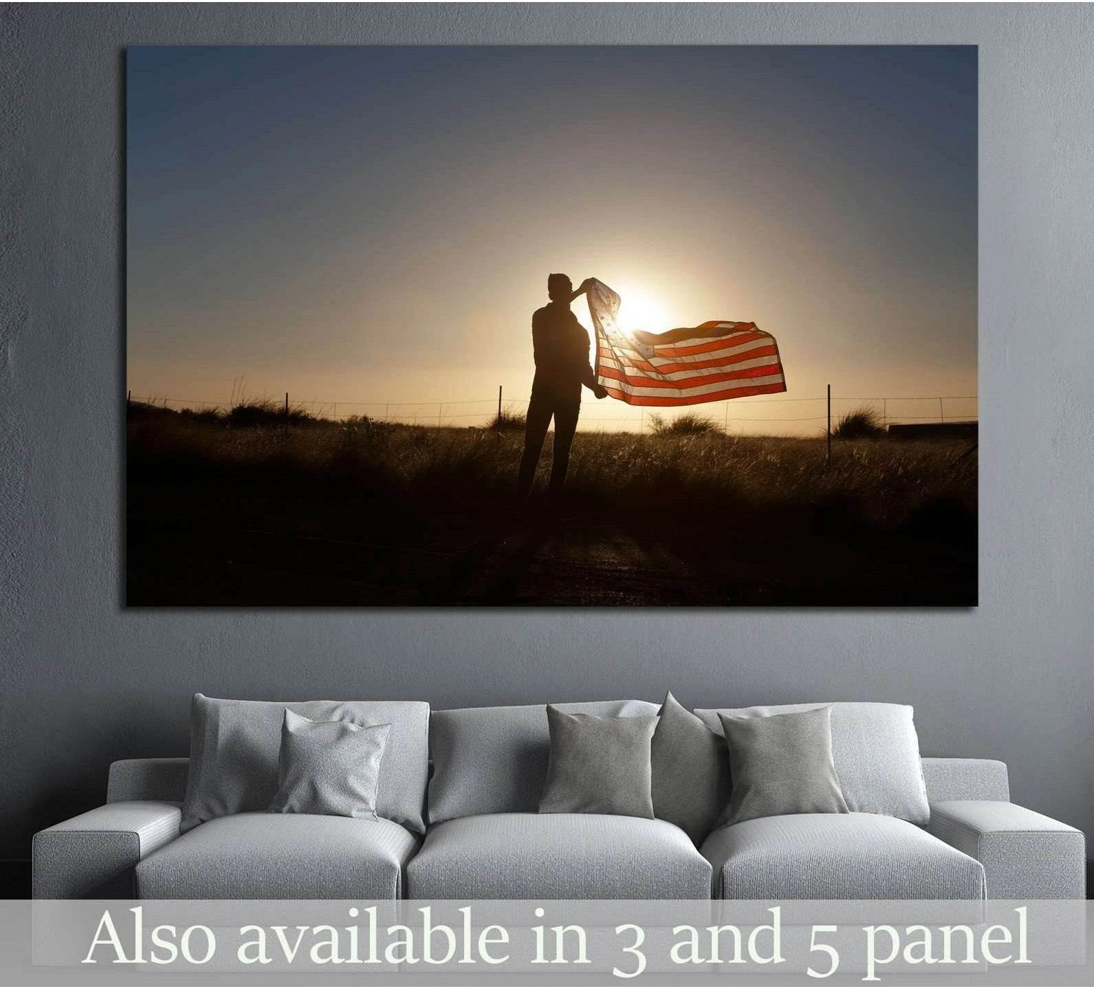 Silhouette holding American flag at sunset canvas print above sofa in a modern living room