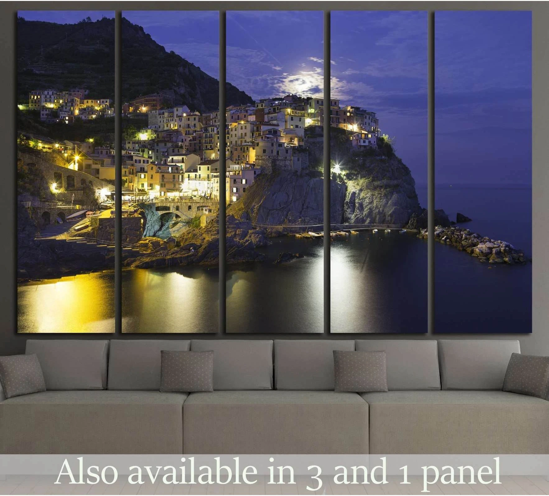 Manarola Cinque Terre canvas print at night above sofa in a modern living room