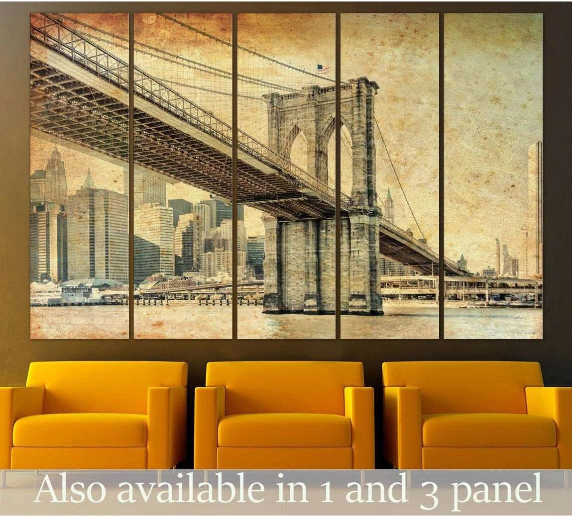 Sepia Manhattan Bridge canvas print with vintage New York skyline, displayed as multi-panel wall art above mustard chairs