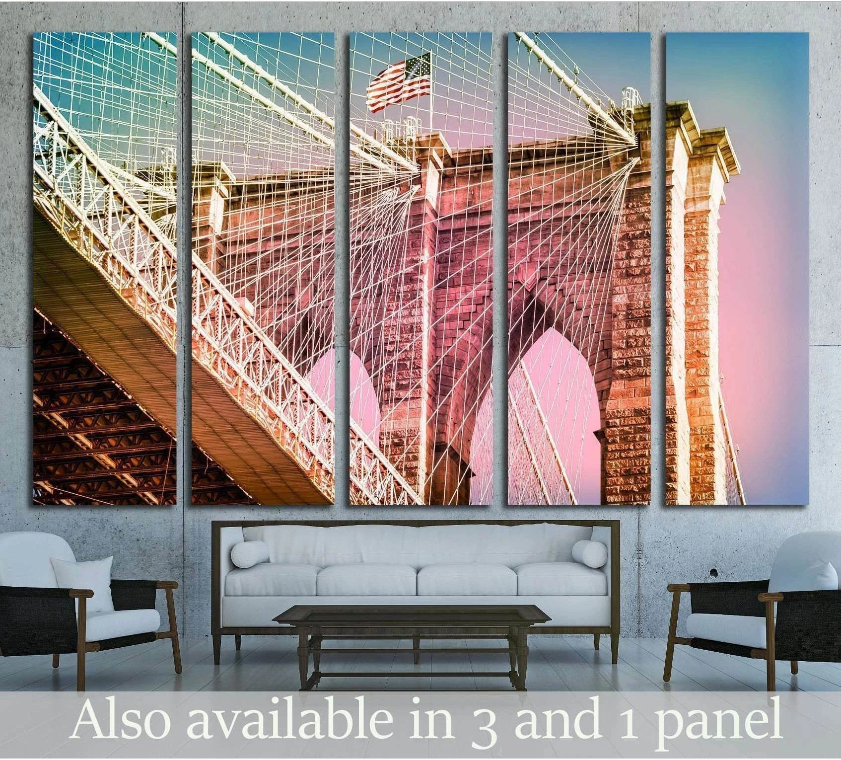Manhattan Bridge canvas print with pink and teal sky above a sofa in a modern living room