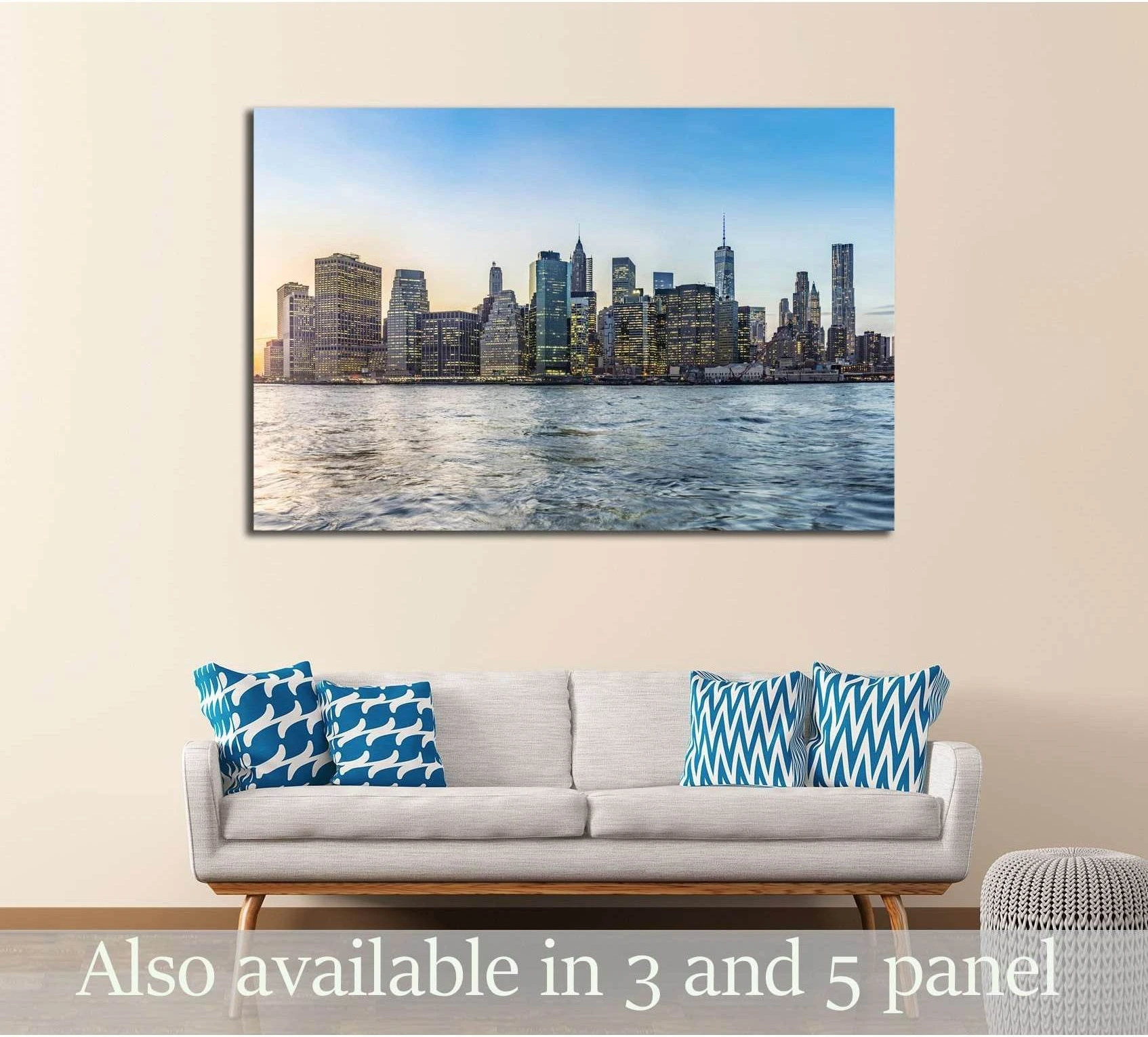 Manhattan skyline canvas print at sunrise hung above a sofa in a modern living room