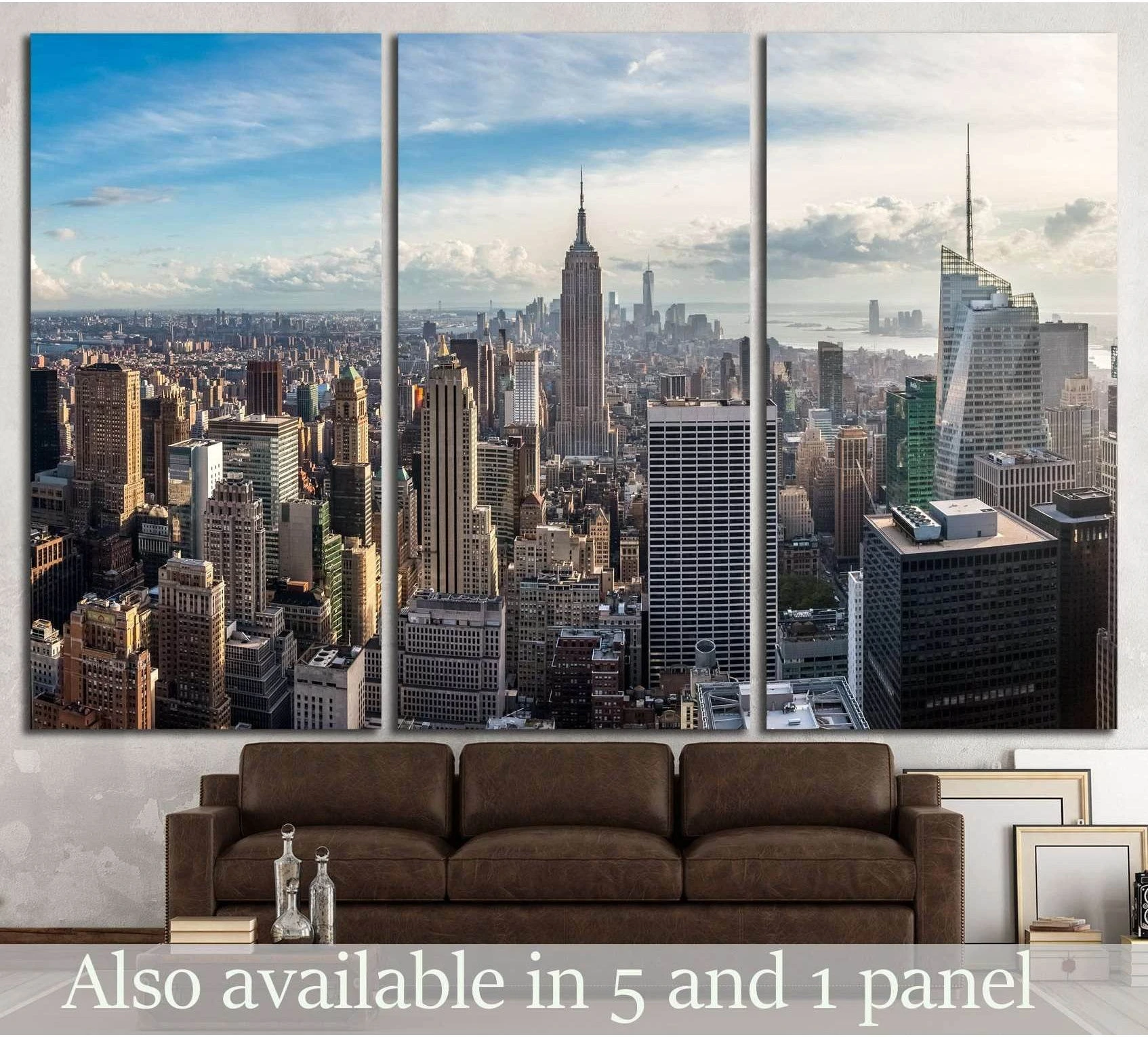 Triptych Manhattan skyline canvas print with Empire State Building above sofa in modern living room