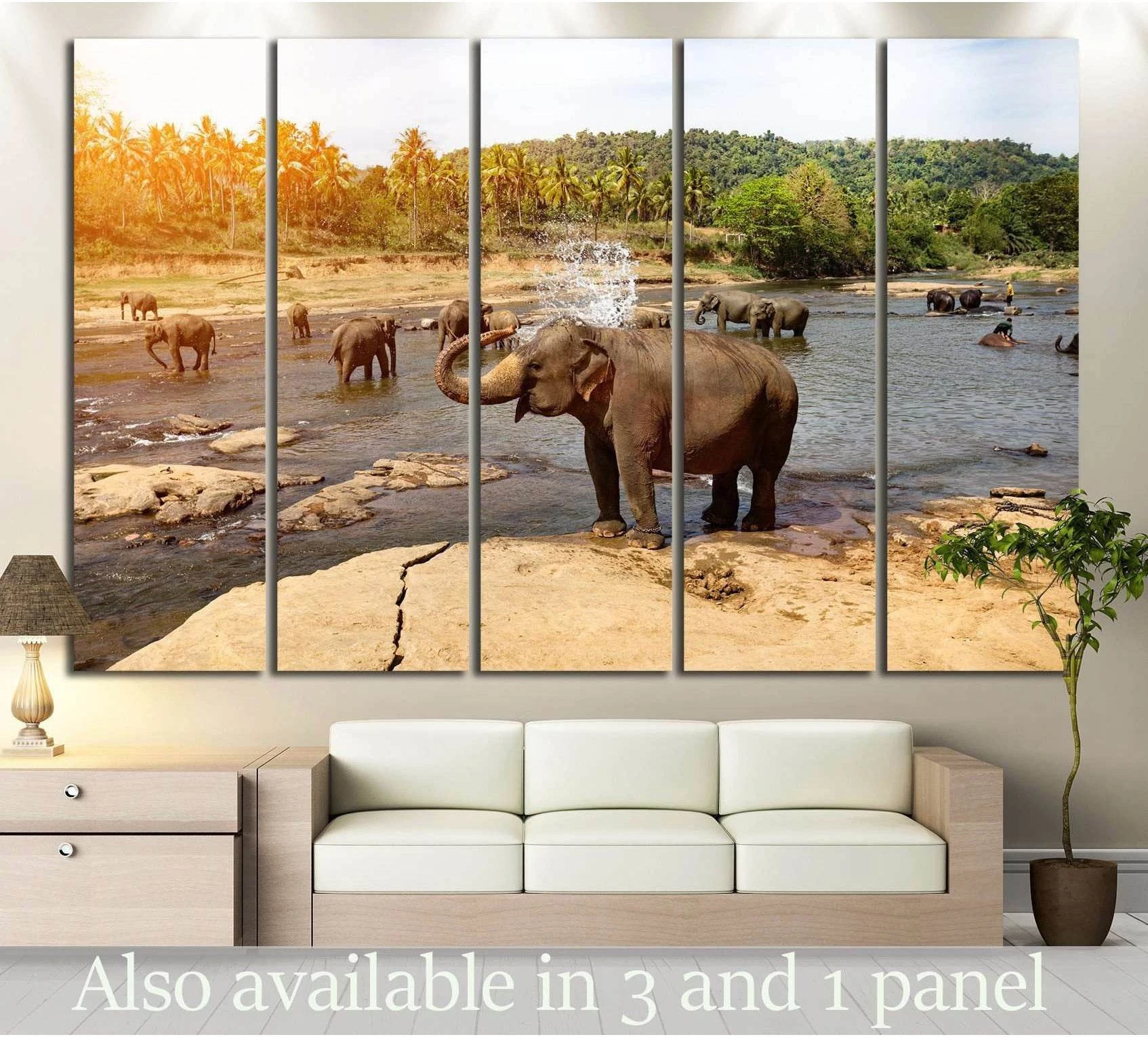 Elephant herd canvas print with elephants bathing in a tropical river above sofa in living room