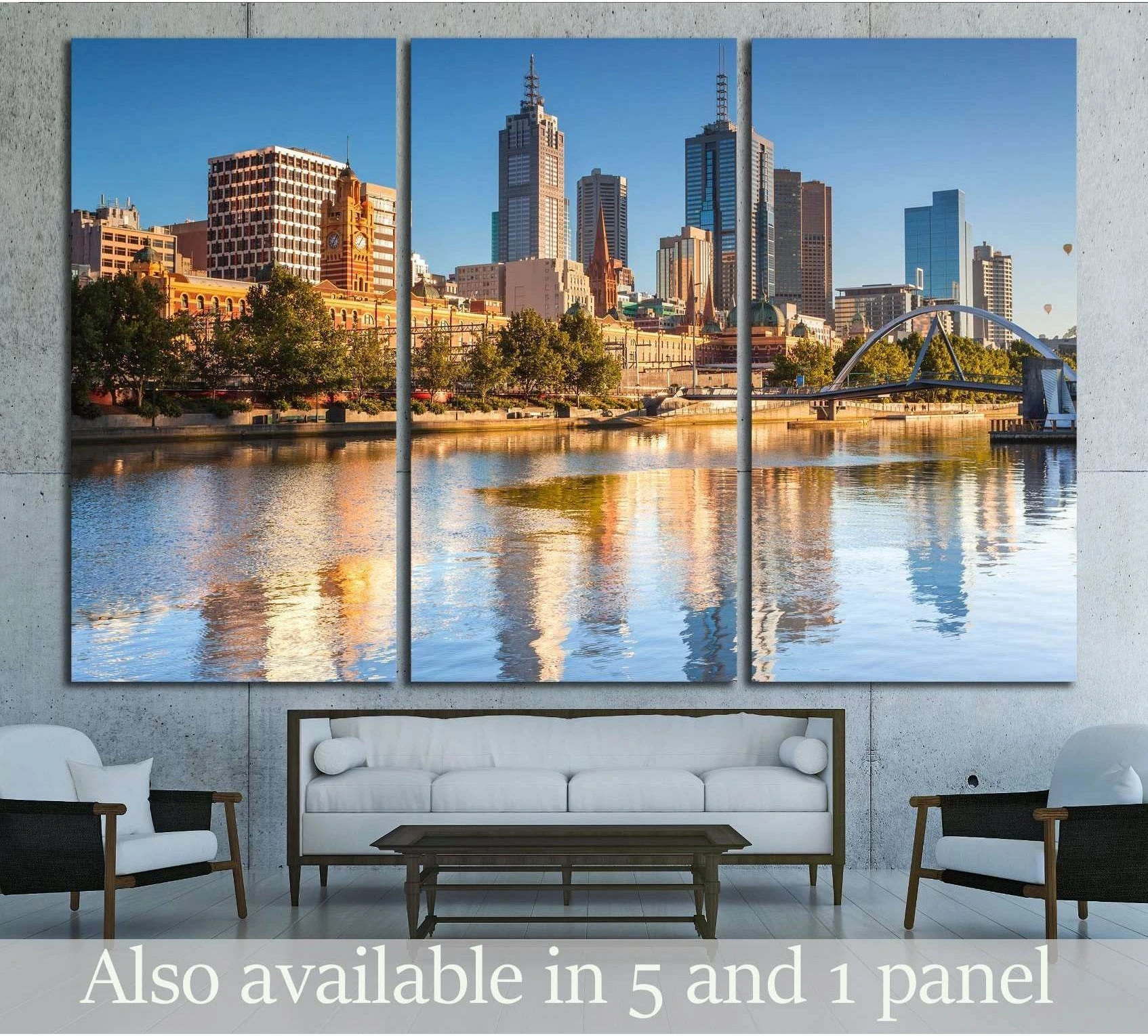 Melbourne skyline canvas print with Yarra River reflections and bridge, displayed above a sofa in a modern living room