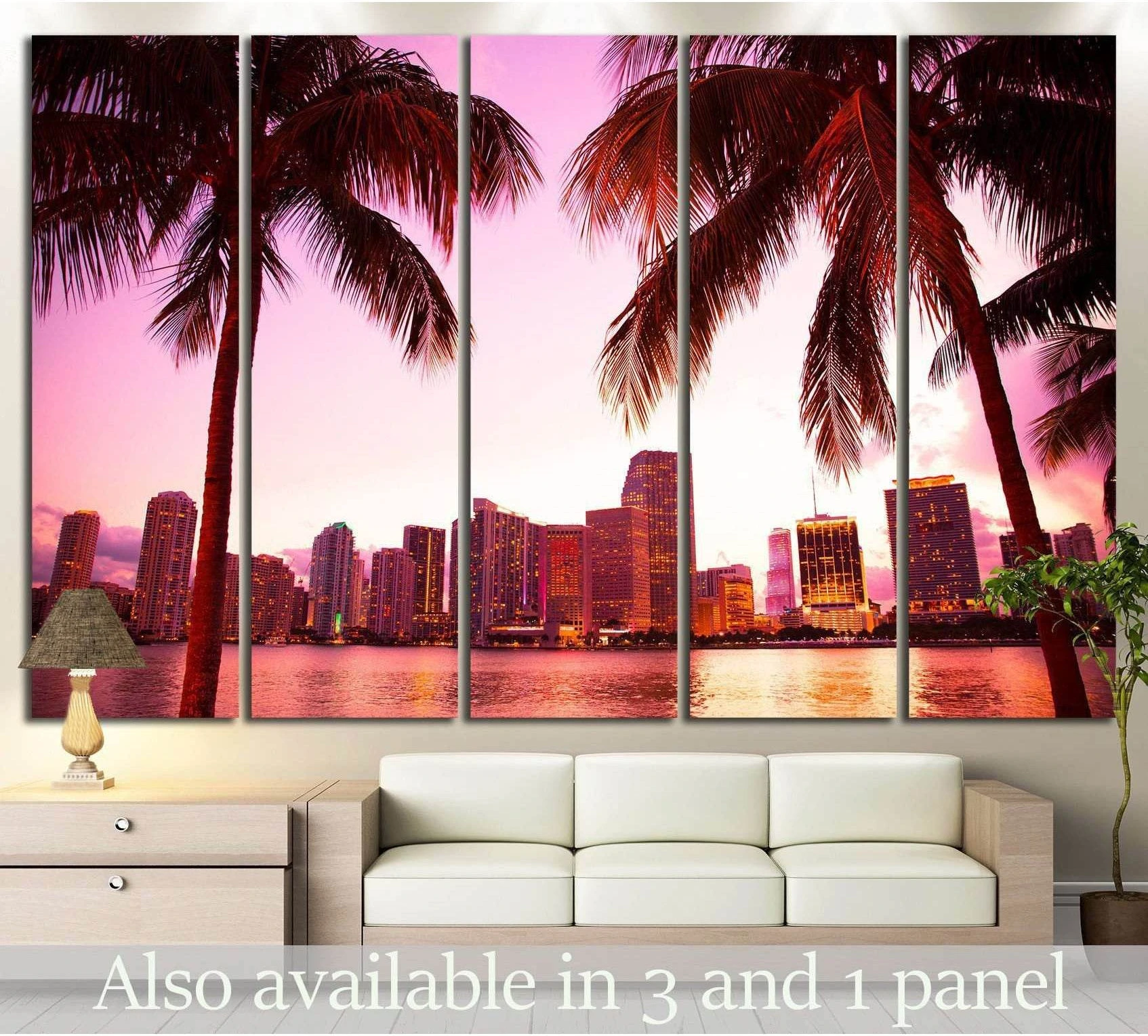Miami skyline canvas print with palm trees and pink sunset sky above a sofa in a modern living room
