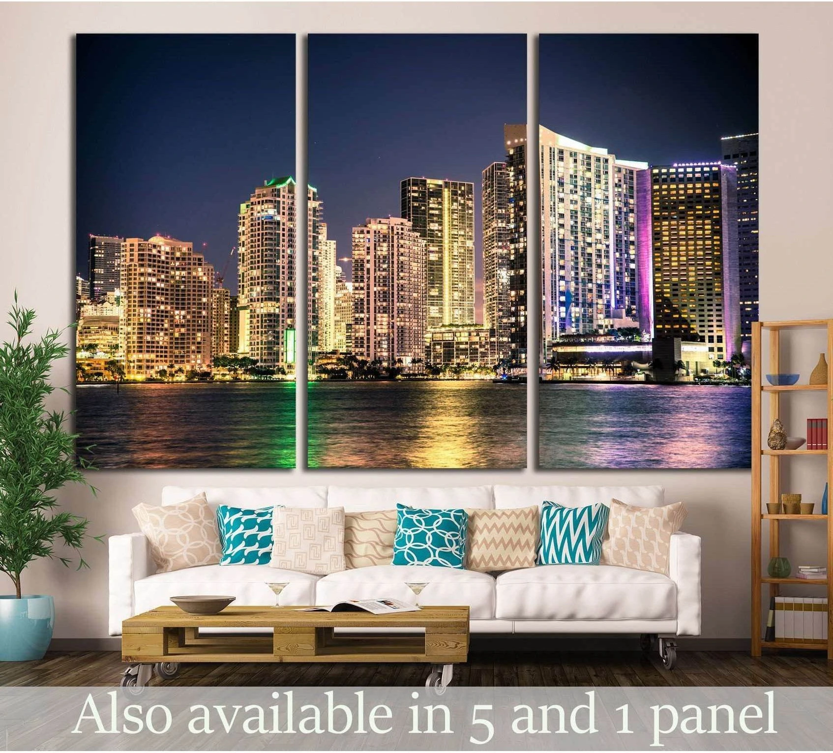 Miami skyline triptych canvas print with colorful night lights above a sofa in a modern living room