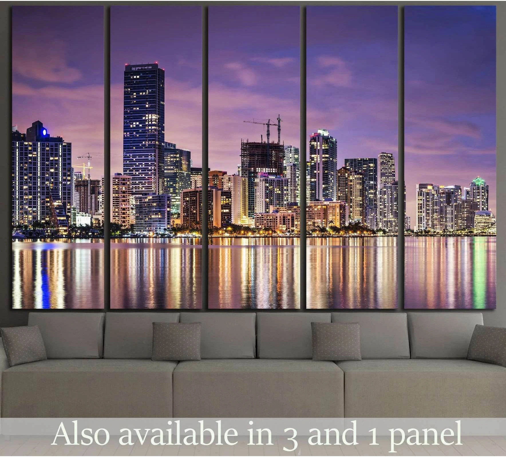 Miami skyline canvas print with purple dusk sky and waterfront reflections above a sofa