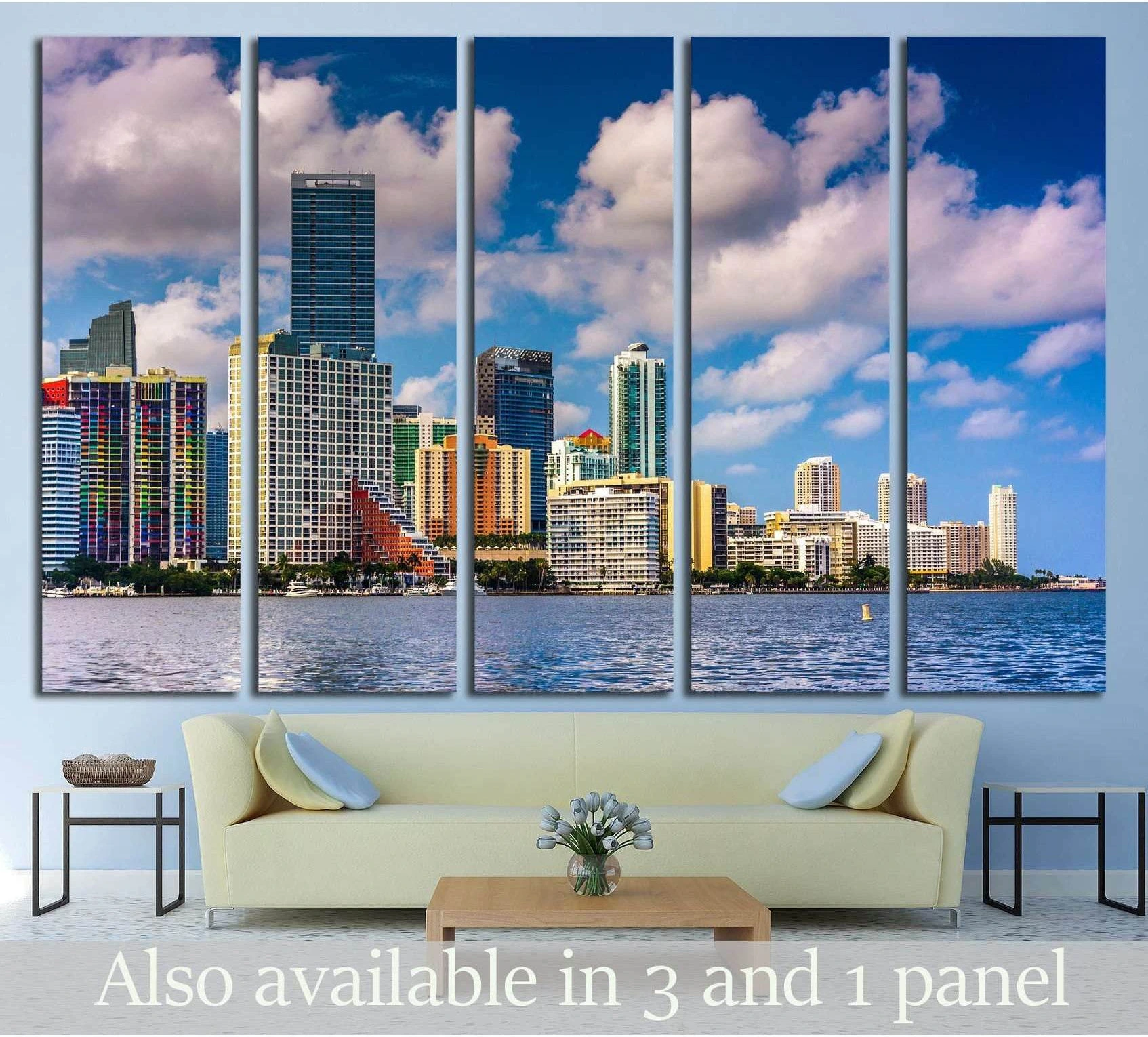Miami skyline canvas print above sofa in modern living room with blue bay and cloud-filled sky