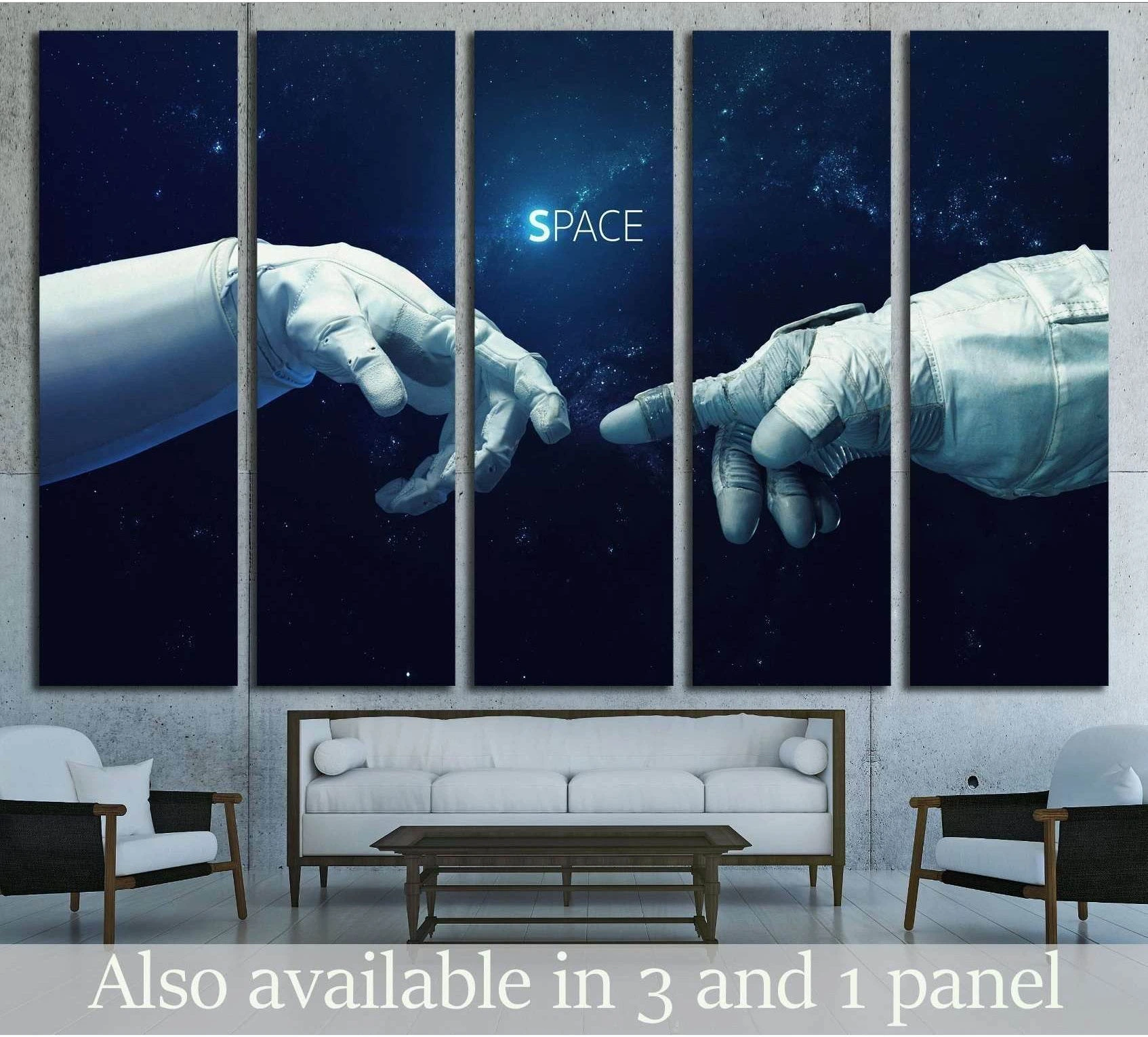 Astronaut hands canvas print in a five-panel starfield display above a sofa in a modern living room