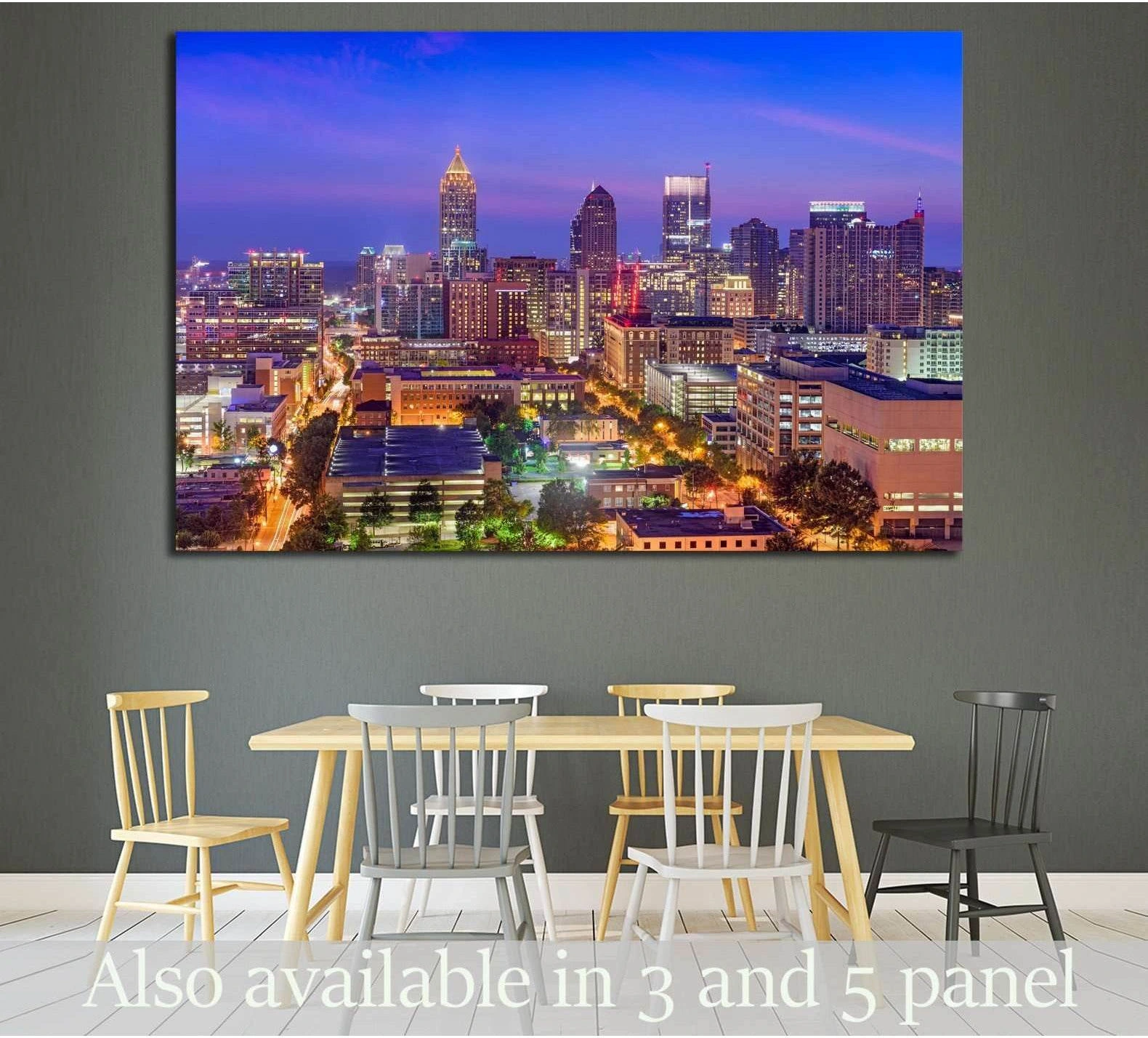 Midtown Atlanta skyline canvas print with glowing dusk city lights above a dining table in a modern room