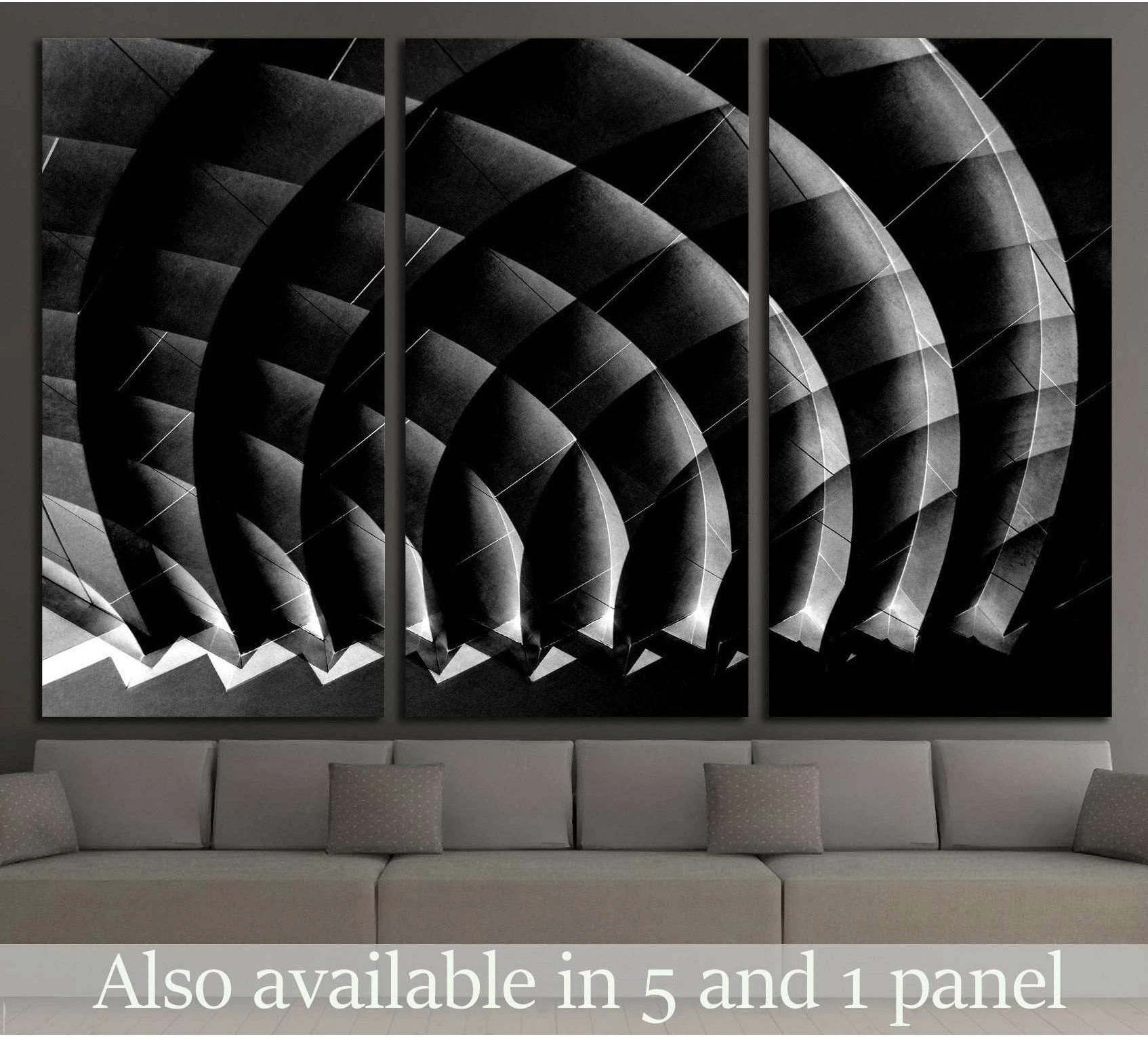 Black and white architectural canvas print with curved interior forms above a sofa