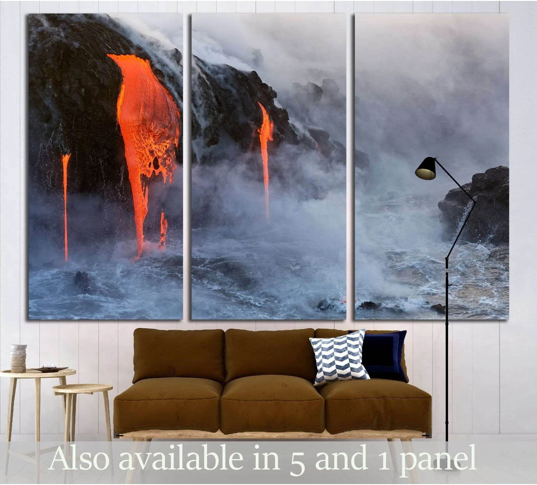 Triptych molten lava canvas print pouring into the ocean with steam and black volcanic cliffs above a sofa