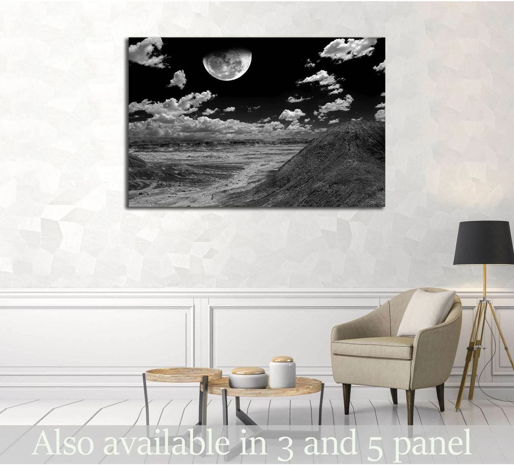 Black and white Arizona desert canvas print with large moon over rugged badlands in living room mockup