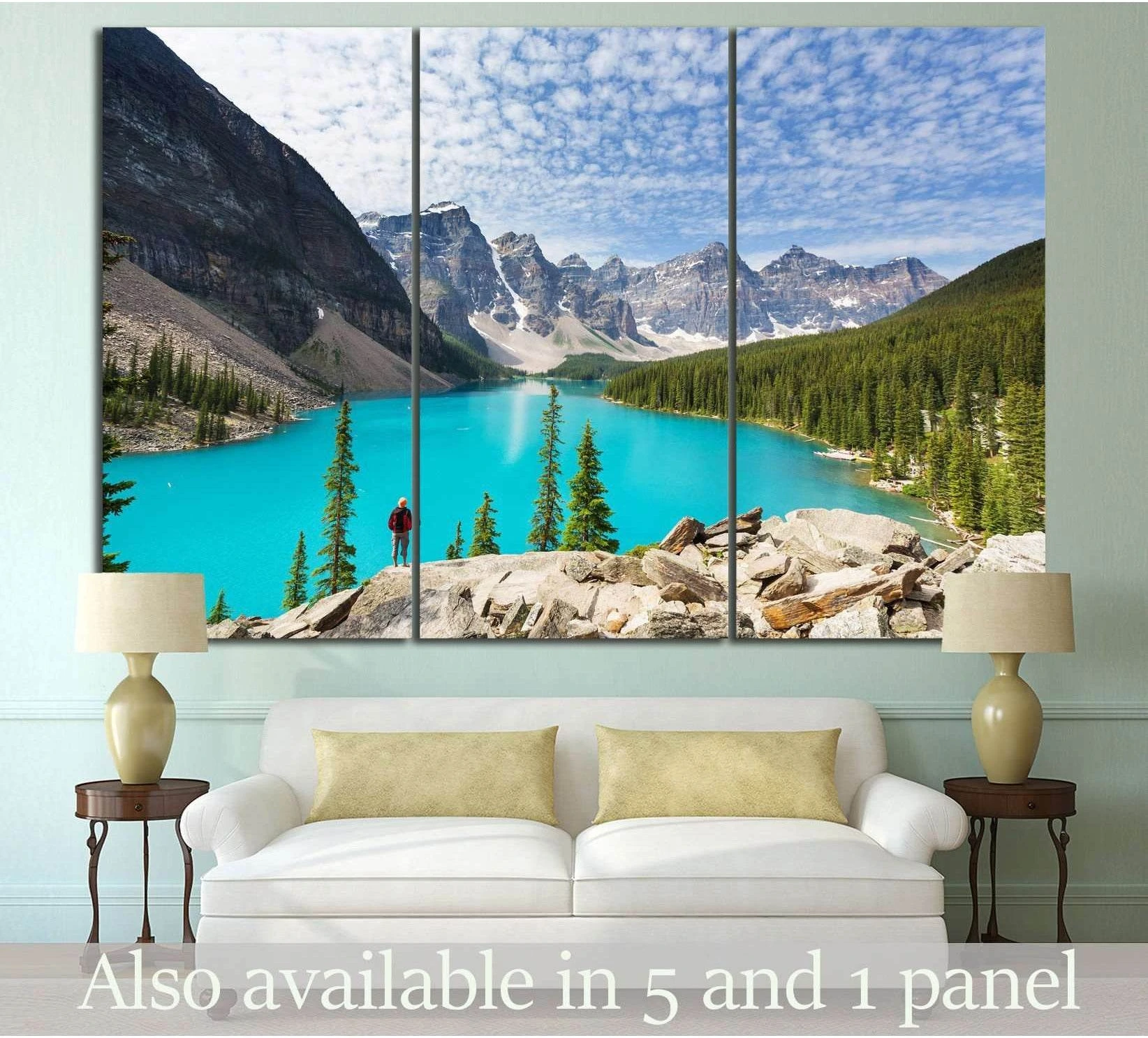 Moraine Lake triptych canvas print above sofa with turquoise lake, pine forest, and Canadian Rockies