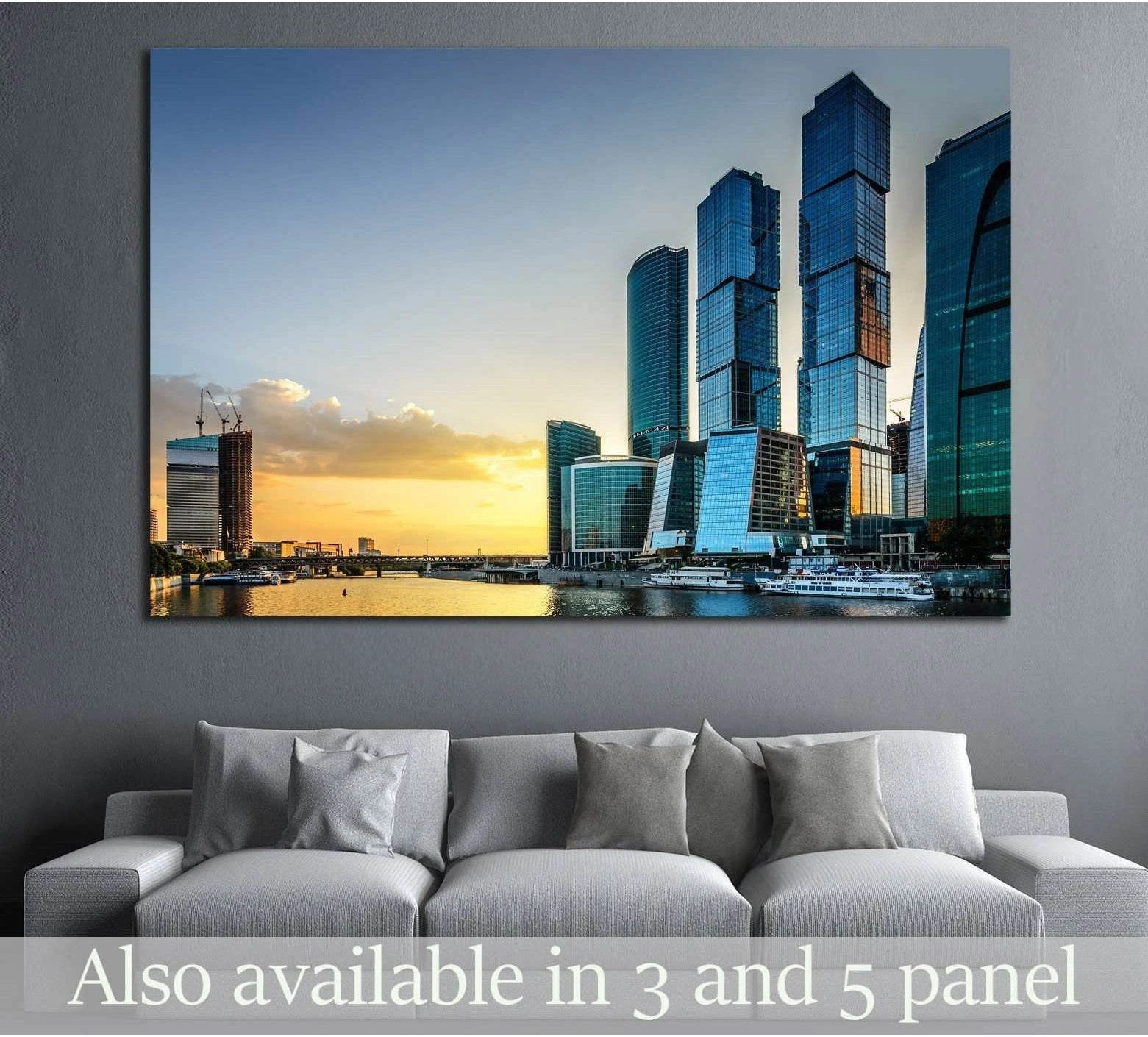 Moscow City skyline canvas print with blue glass towers above a sofa in a modern living room