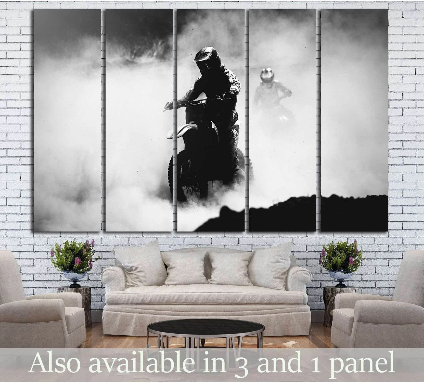 Black and white motocross canvas print with dirt bike riders racing through dust above a sofa
