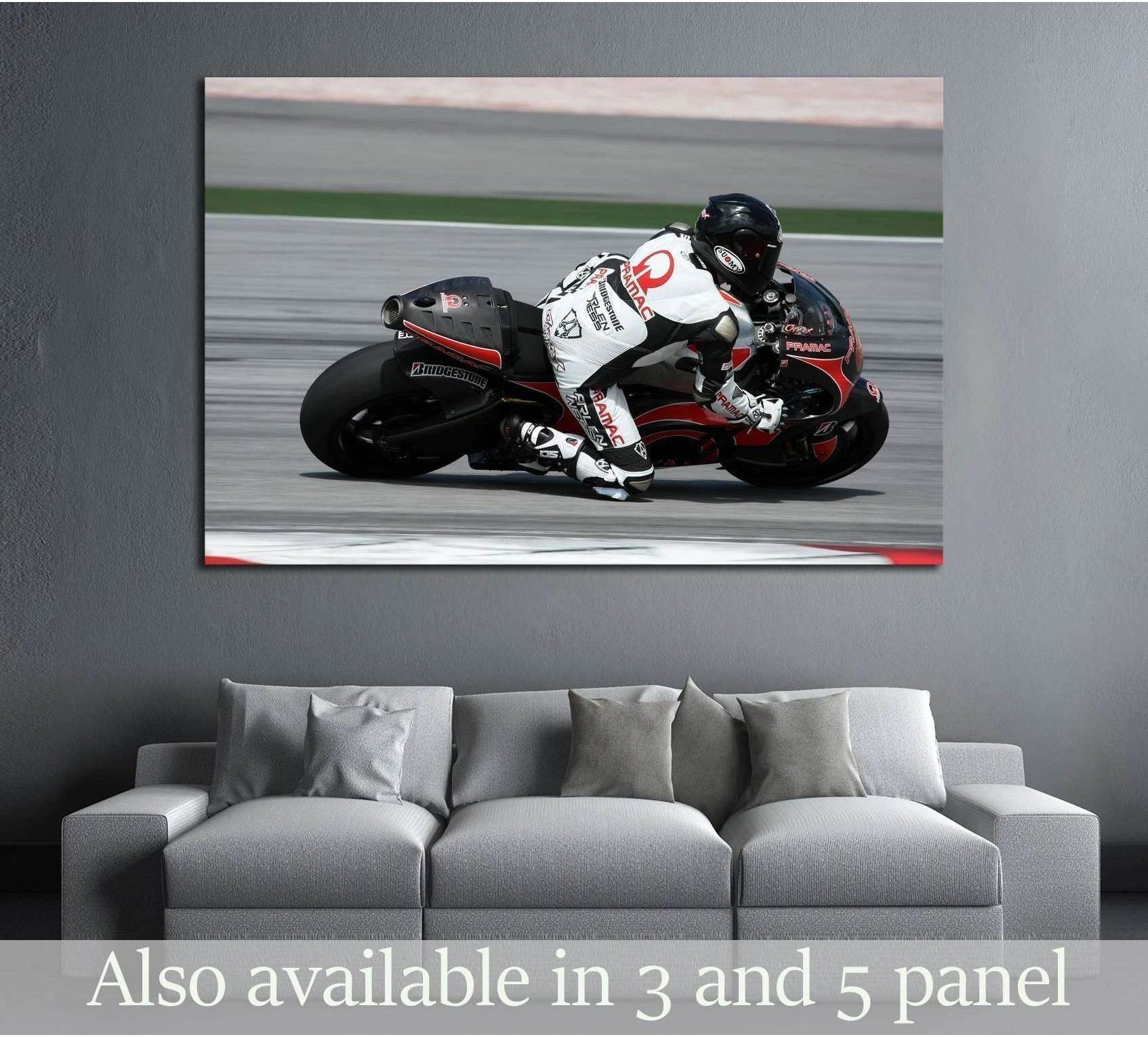 MotoGP rider on Pramac Racing bike leaning into a turn canvas print above a gray sofa