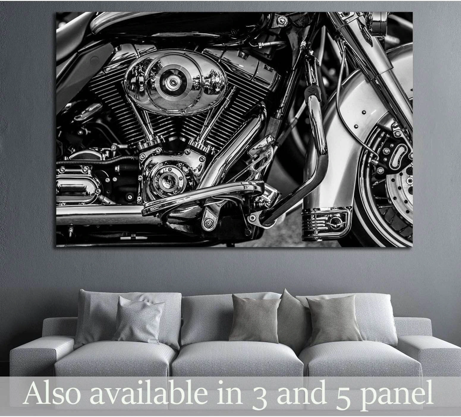 Black and white motorcycle engine canvas print hung above a sofa in a modern living room