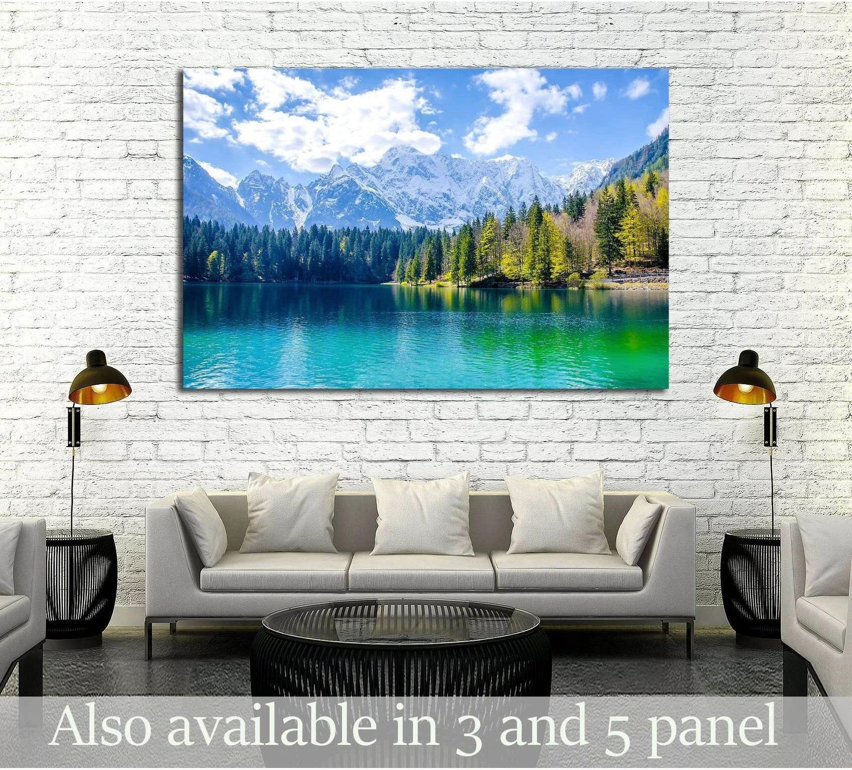 Turquoise alpine lake canvas print with snow-capped mountains above sofa in modern living room