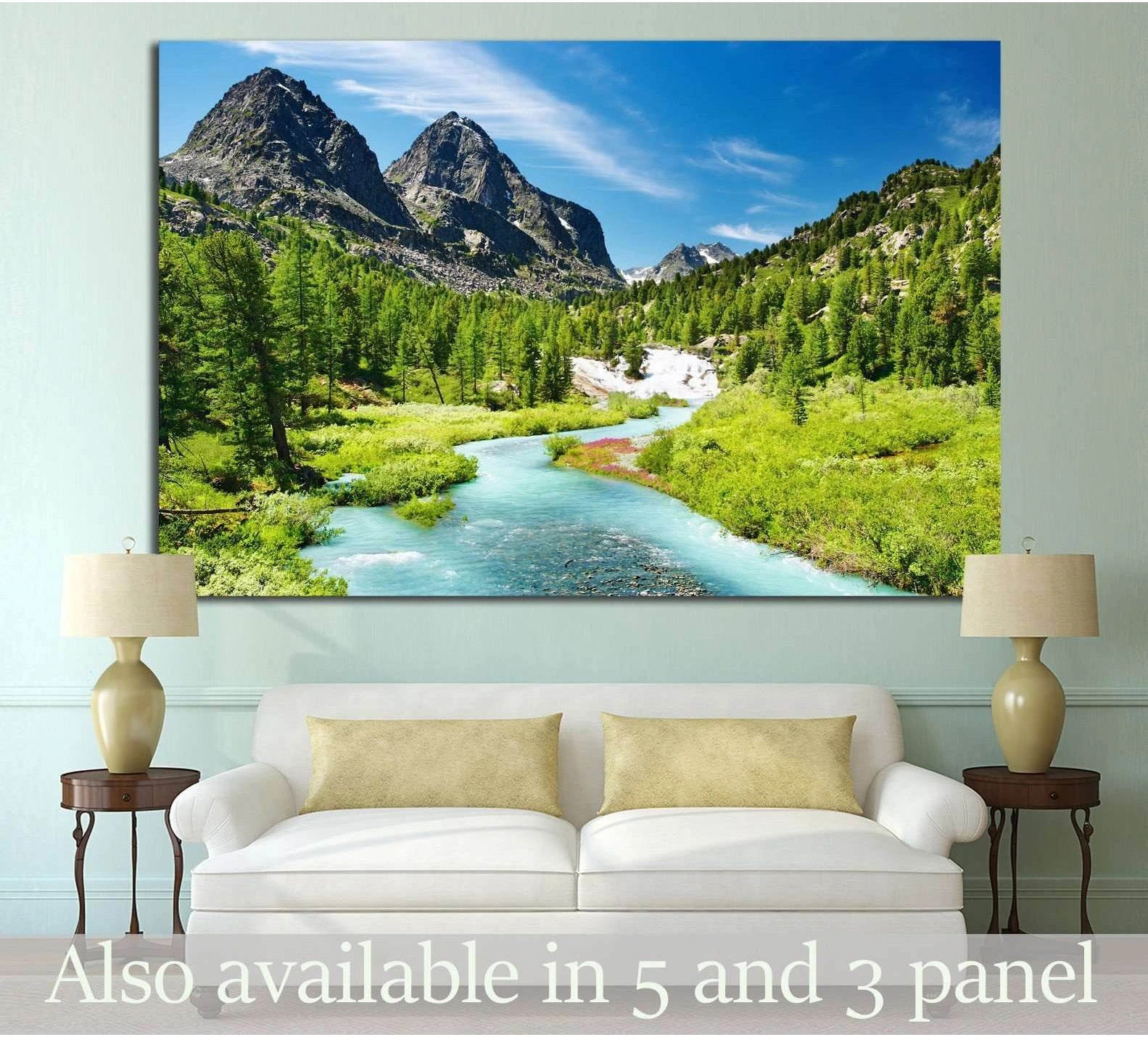 Mountain landscape canvas print above sofa with turquoise river, pine forest, and alpine peaks