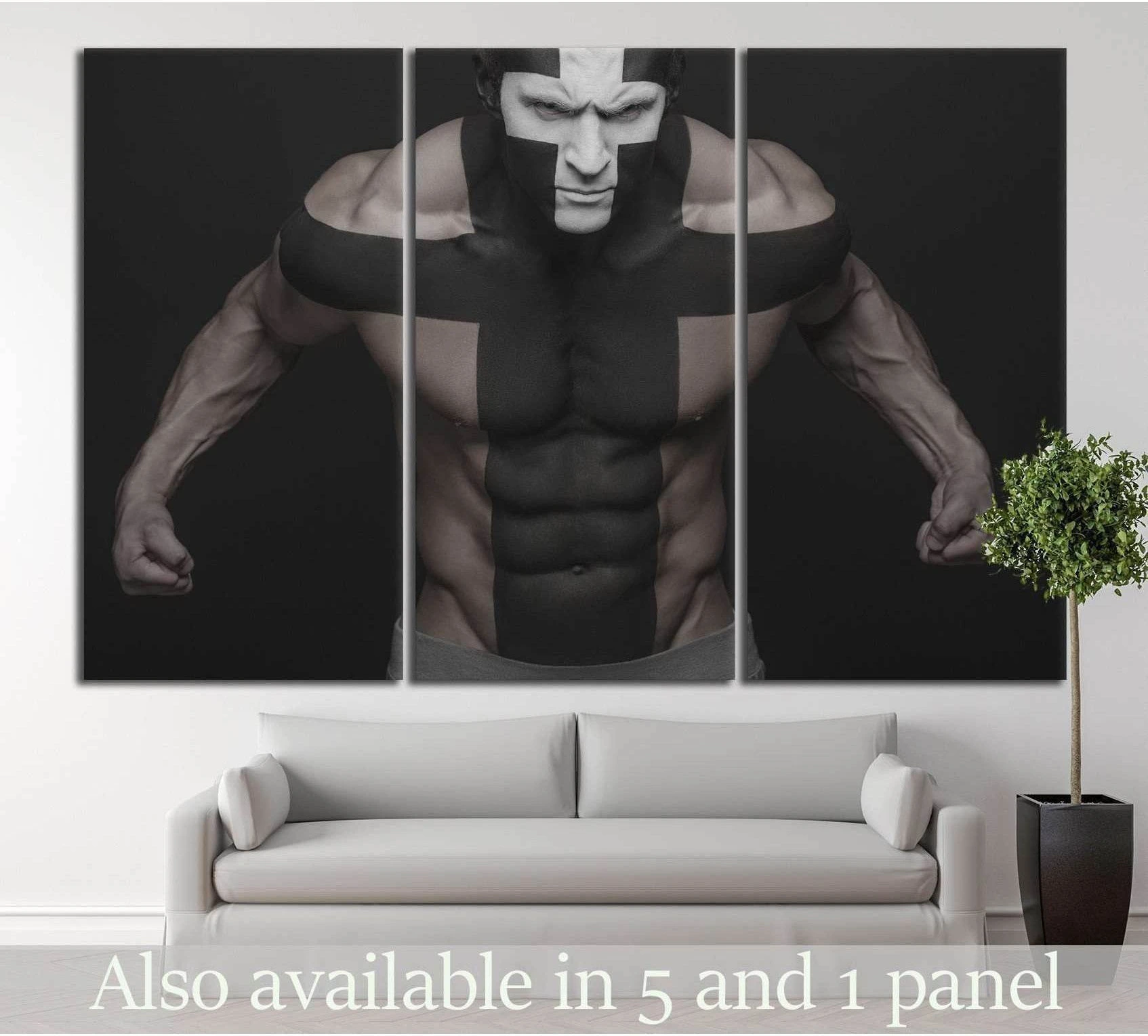 Black and white muscle man triptych canvas print above a sofa in a modern living room