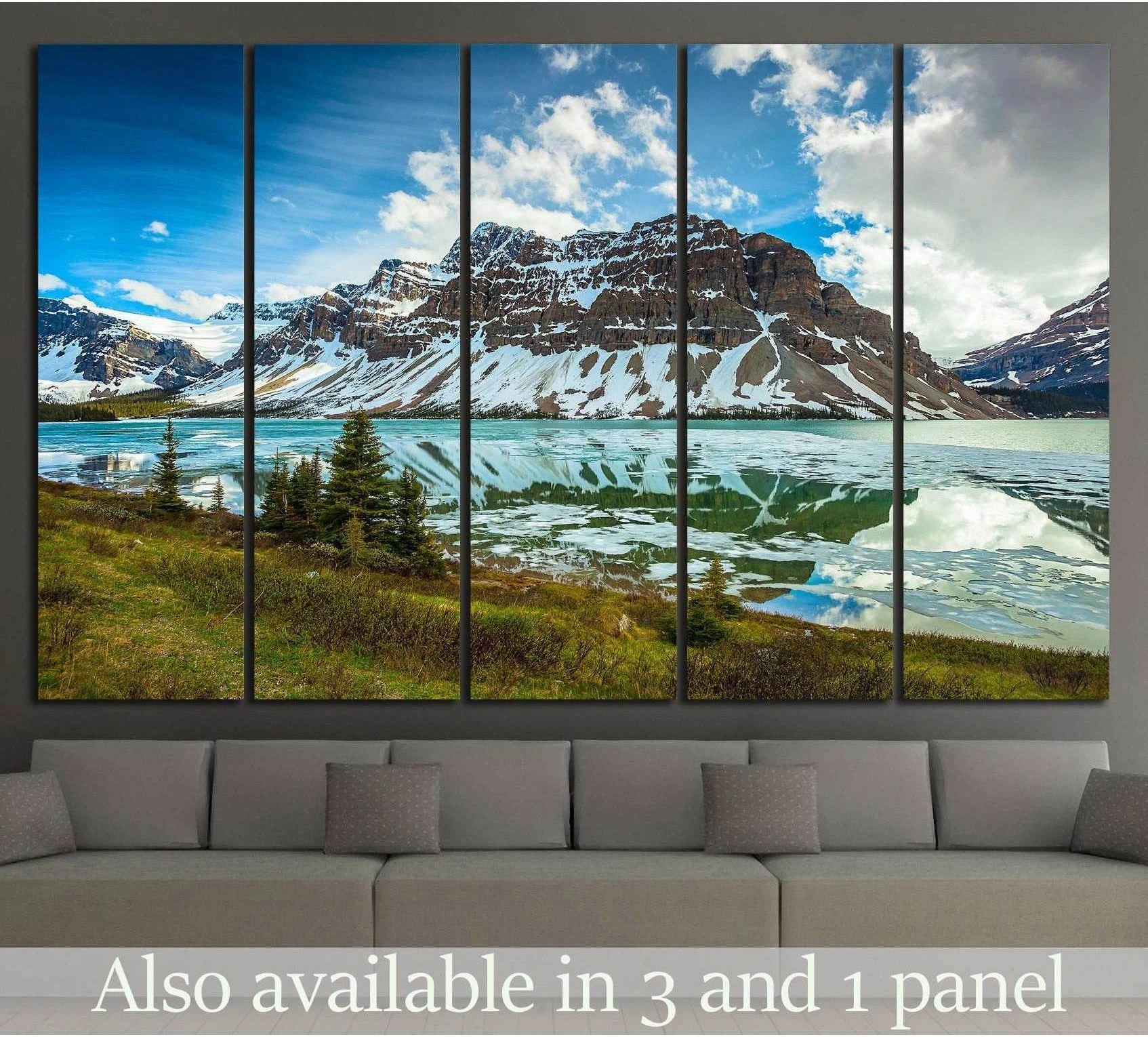 Canadian Rockies mountain lake canvas print displayed above sofa in a modern living room
