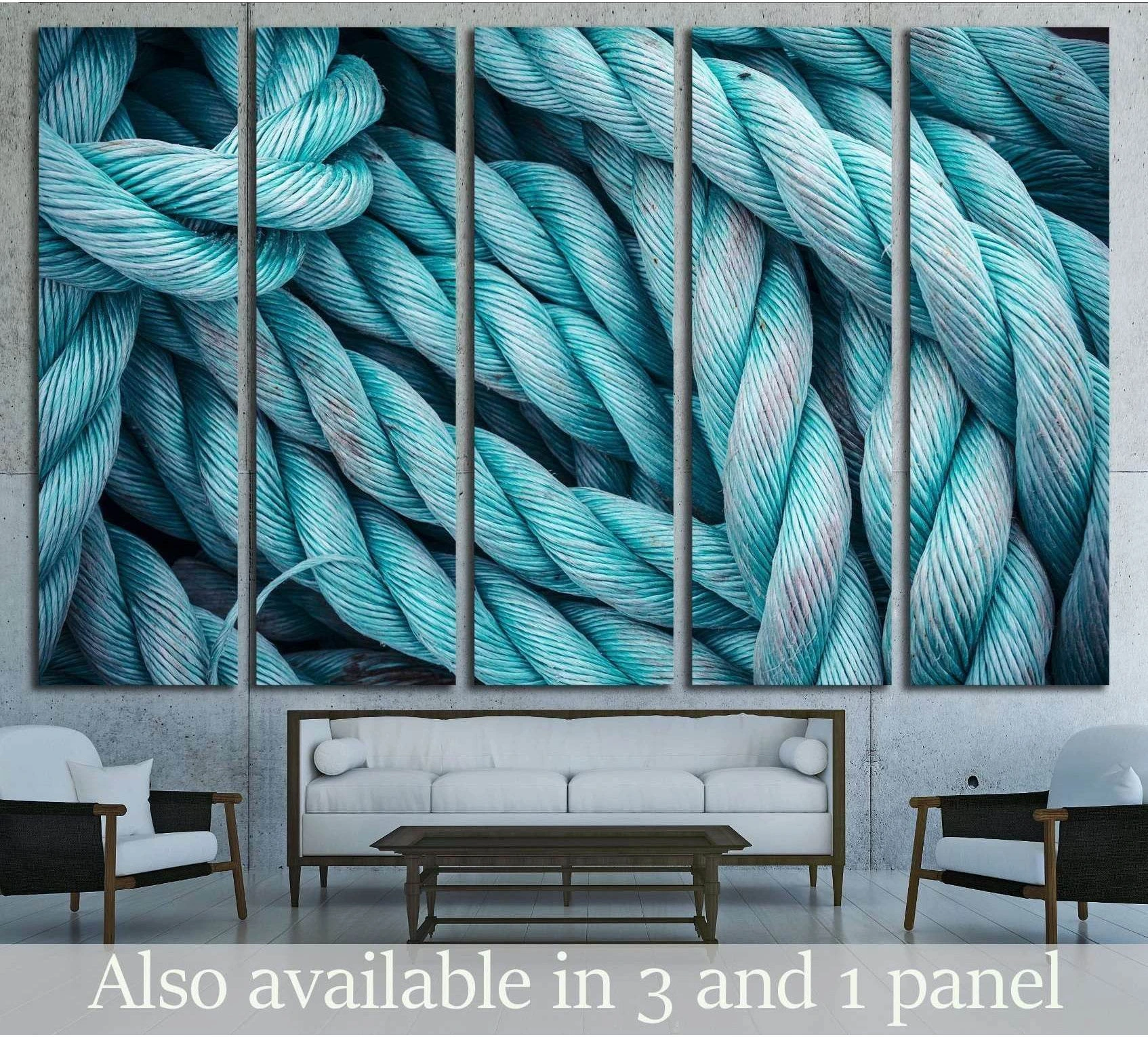 Blue frayed boat rope close-up canvas print hung above a sofa in a coastal living room