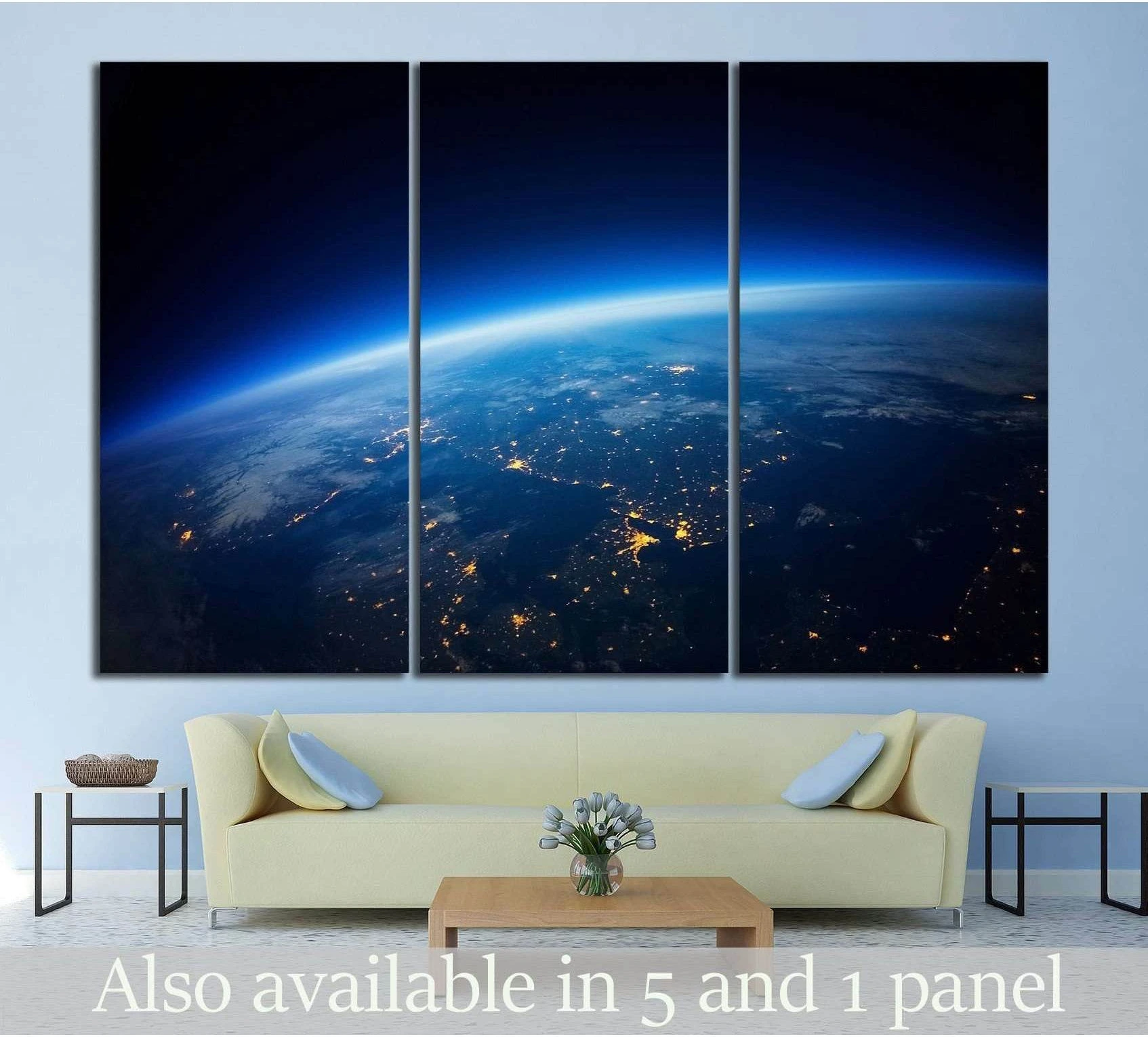 Earth from orbit triptych canvas print with blue atmosphere and glowing city lights above a modern sofa